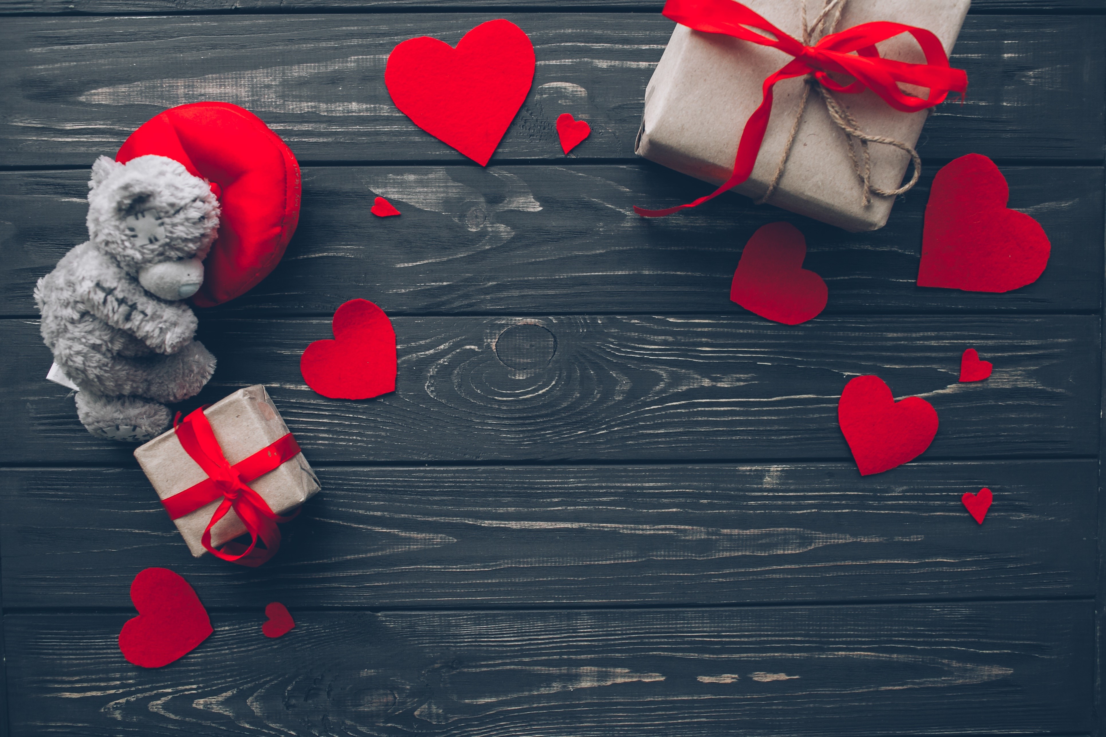 Valentine's Day gifts and hearts on wood planks HD Wallpaper