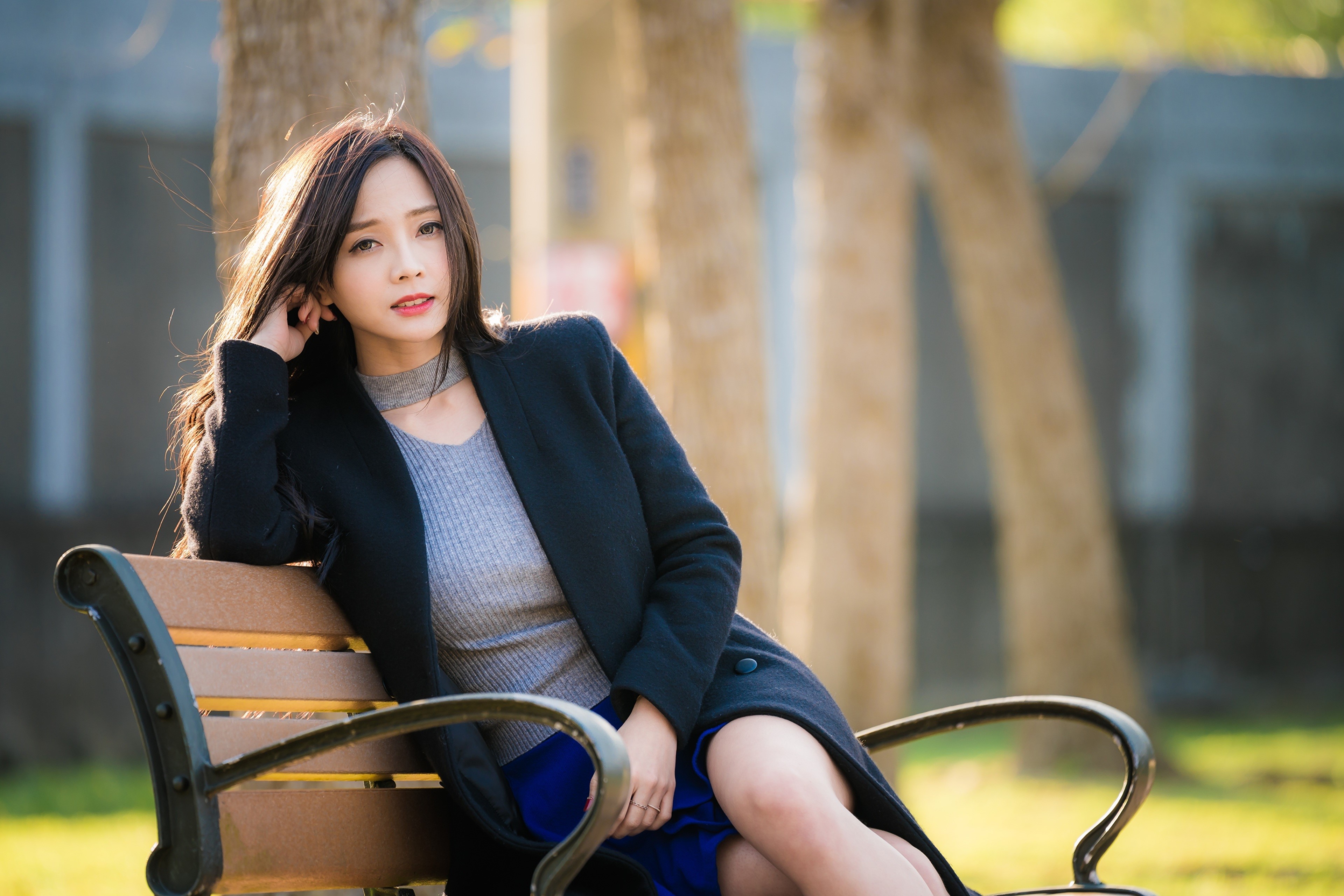 4K Asian Woman Sitting on Bench in Sunlight HD Wallpaper