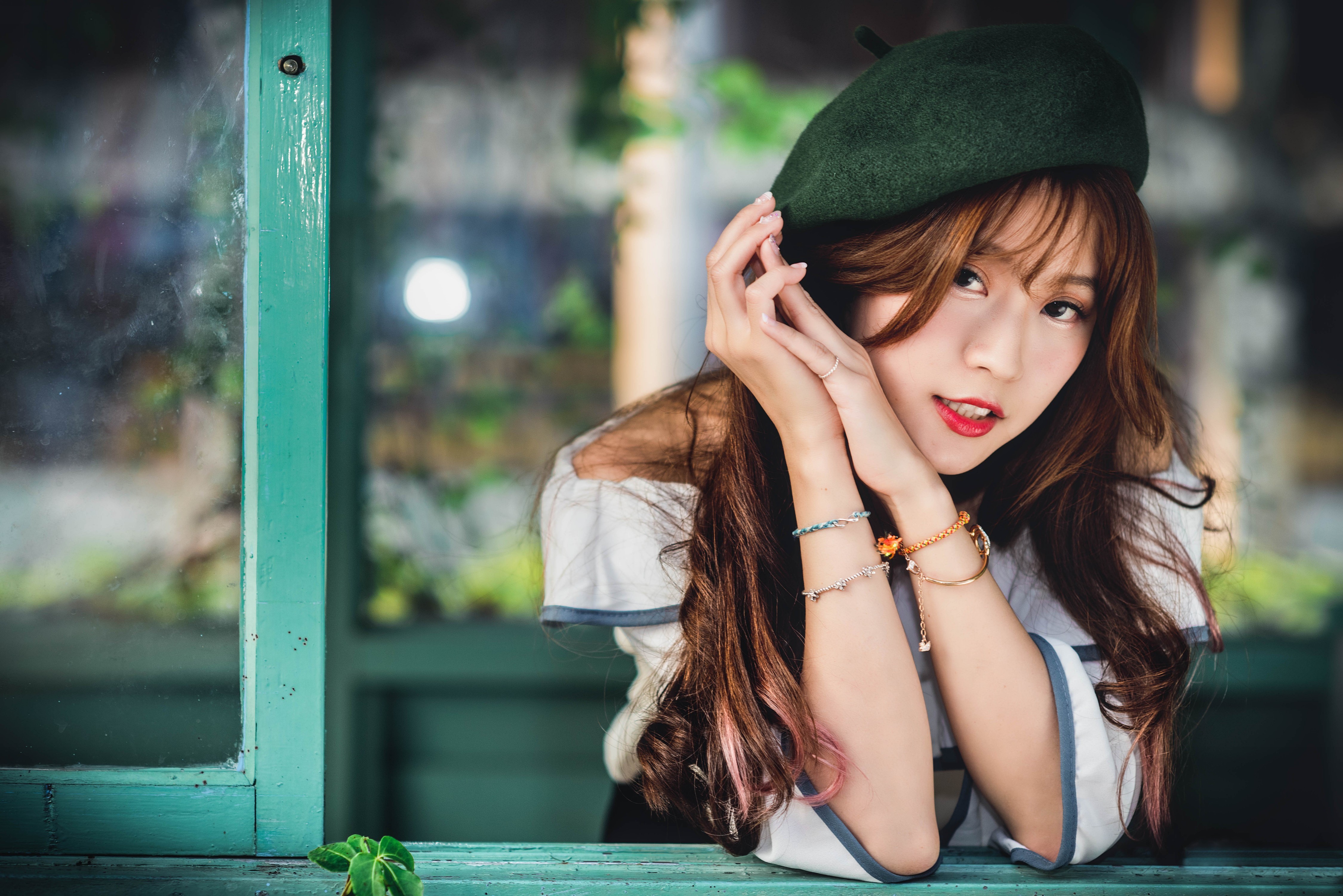 Asian woman with brown hair wearing a green beret HD Wallpaper