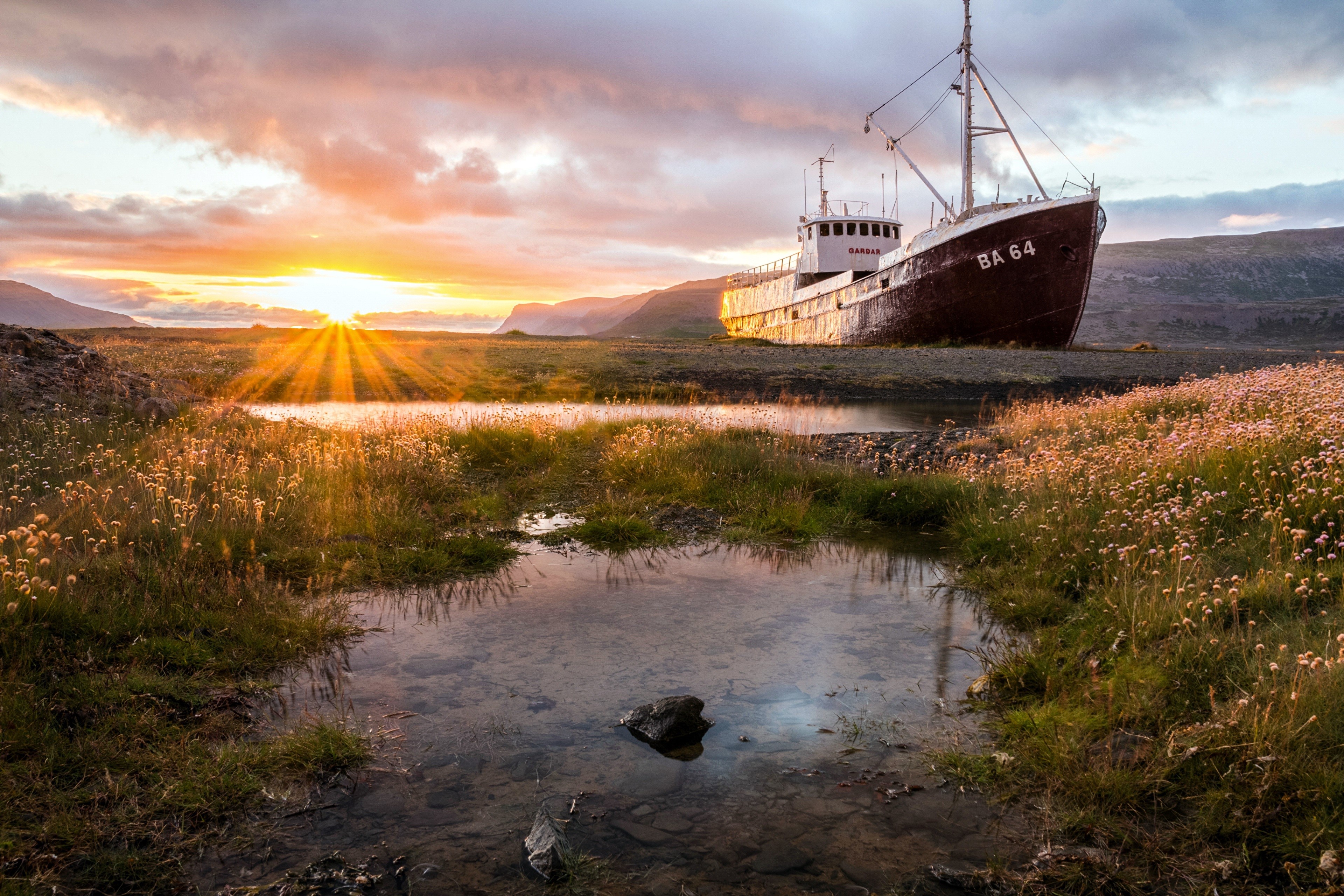 Shipwreck BA 64 at sunset with sun rays HD Wallpaper