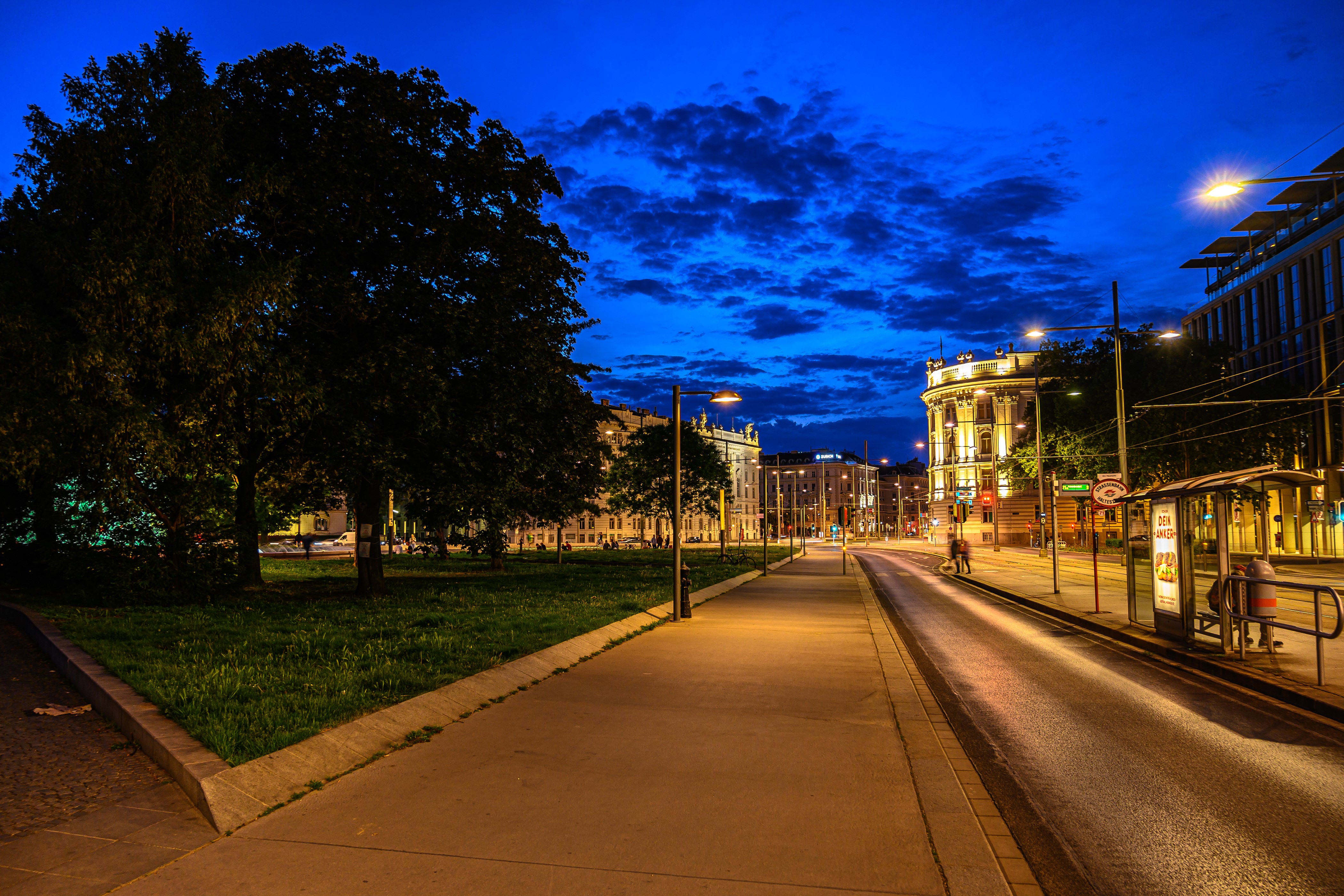 Street scene in Vienna at night with tram tracks HD Wallpaper