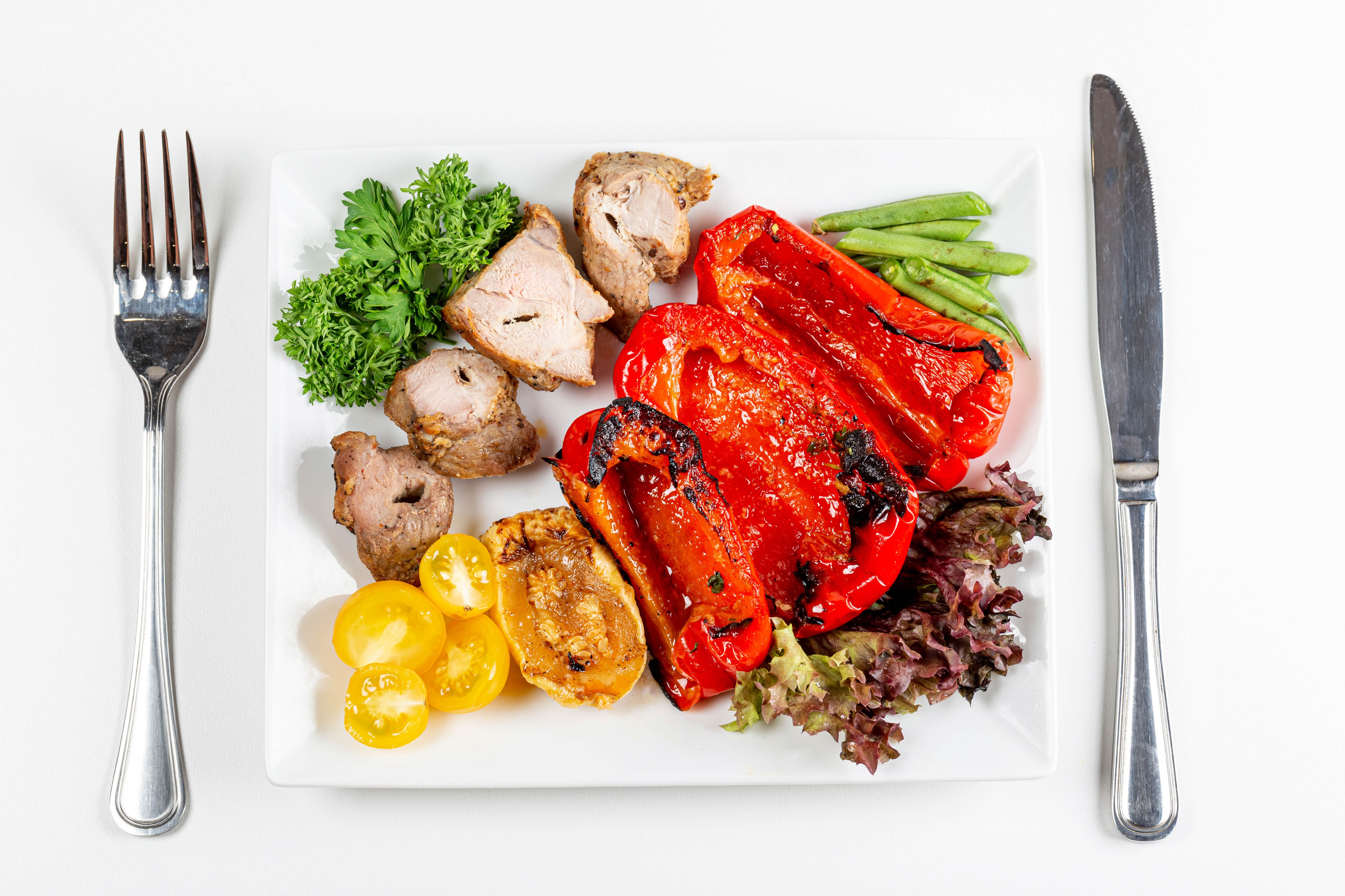 Meat and vegetables with fork and knife HD Wallpaper