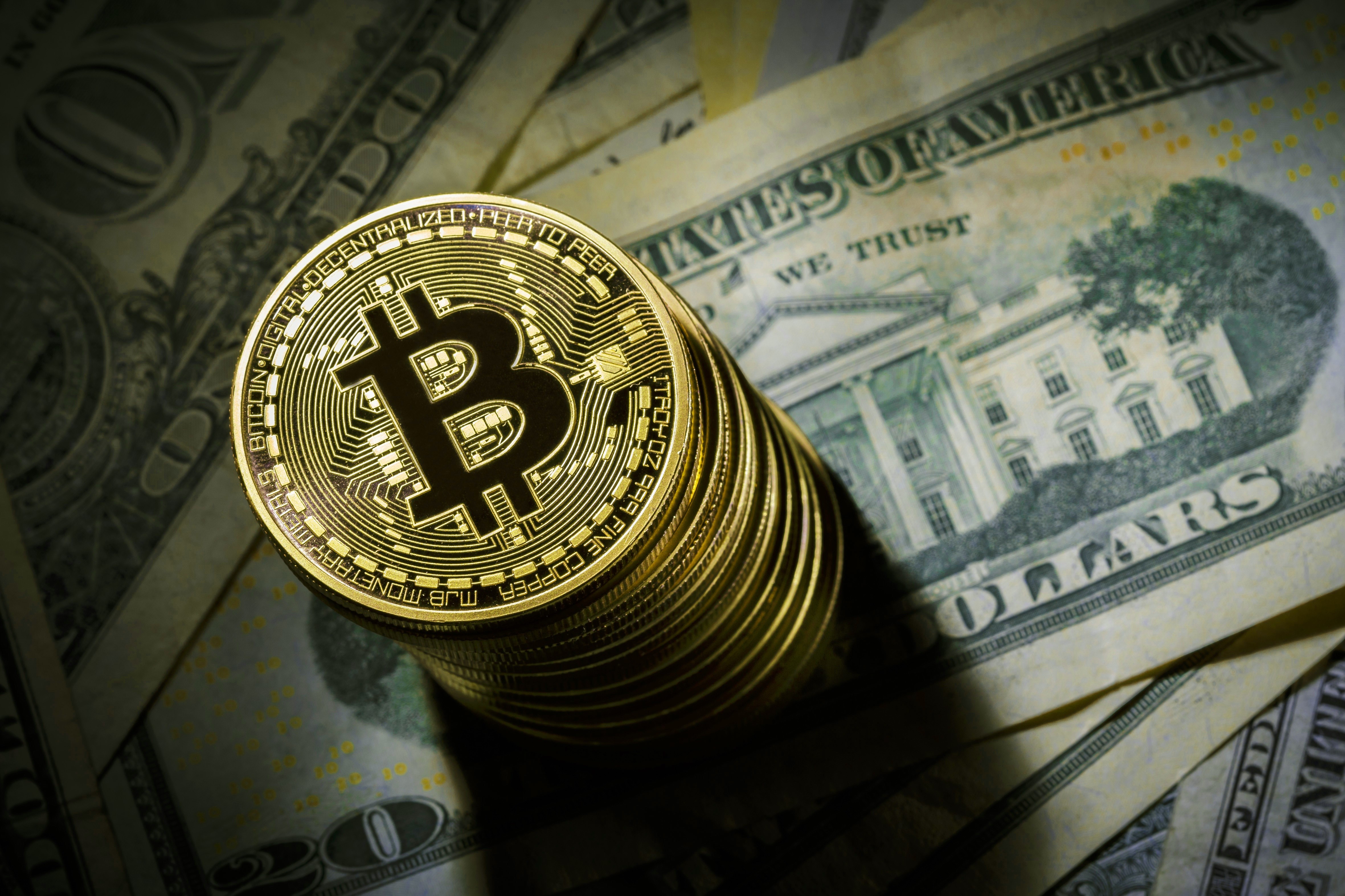 Bitcoin coins on US dollars HD Wallpaper