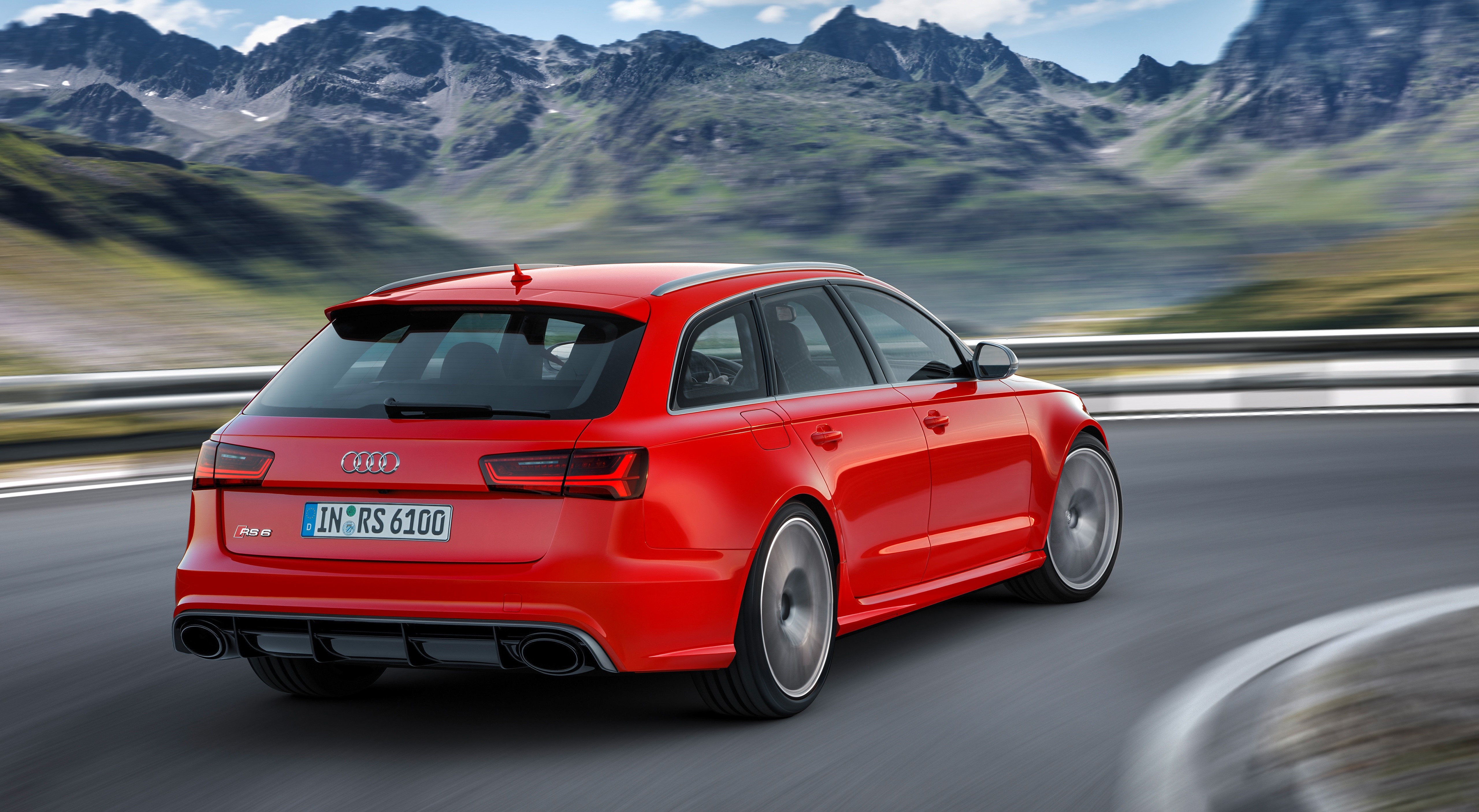 Red Audi RS6 Avant performance car on a mountain road HD Wallpaper