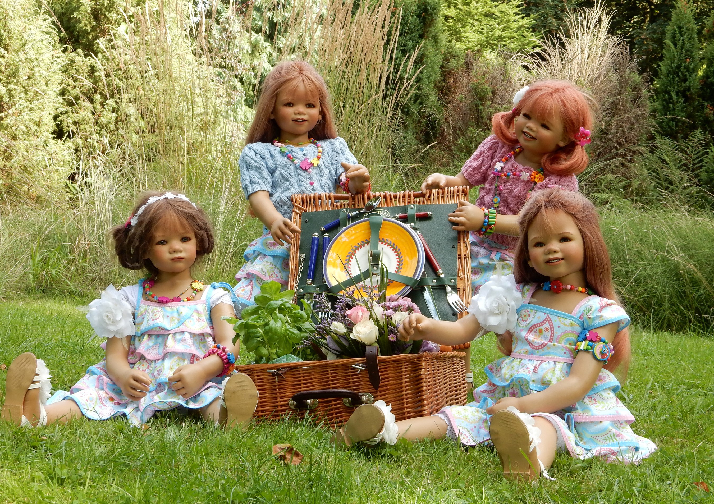 Four dolls having a picnic in a park HD Wallpaper