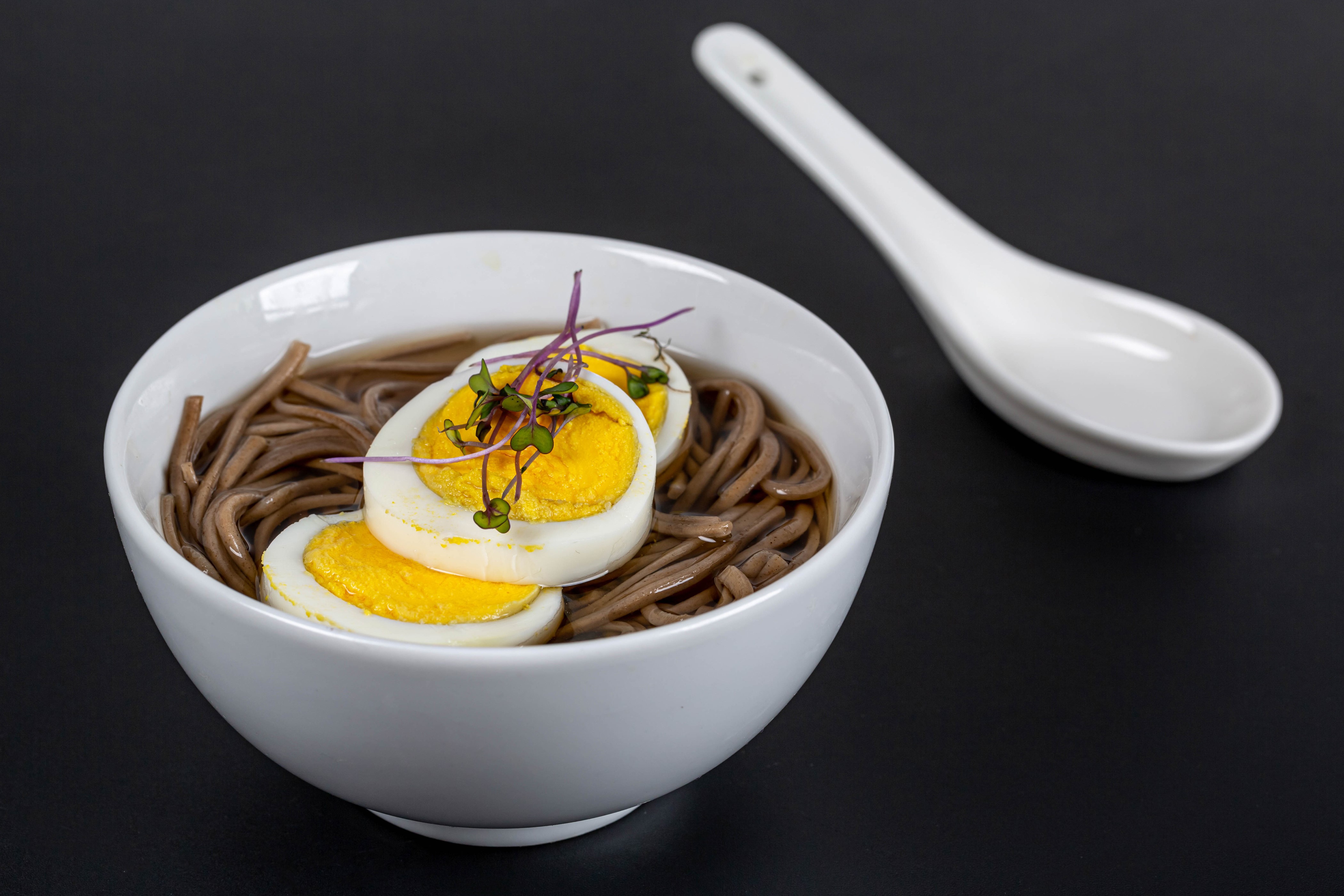 Soba noodles with boiled eggs and spoon HD Wallpaper