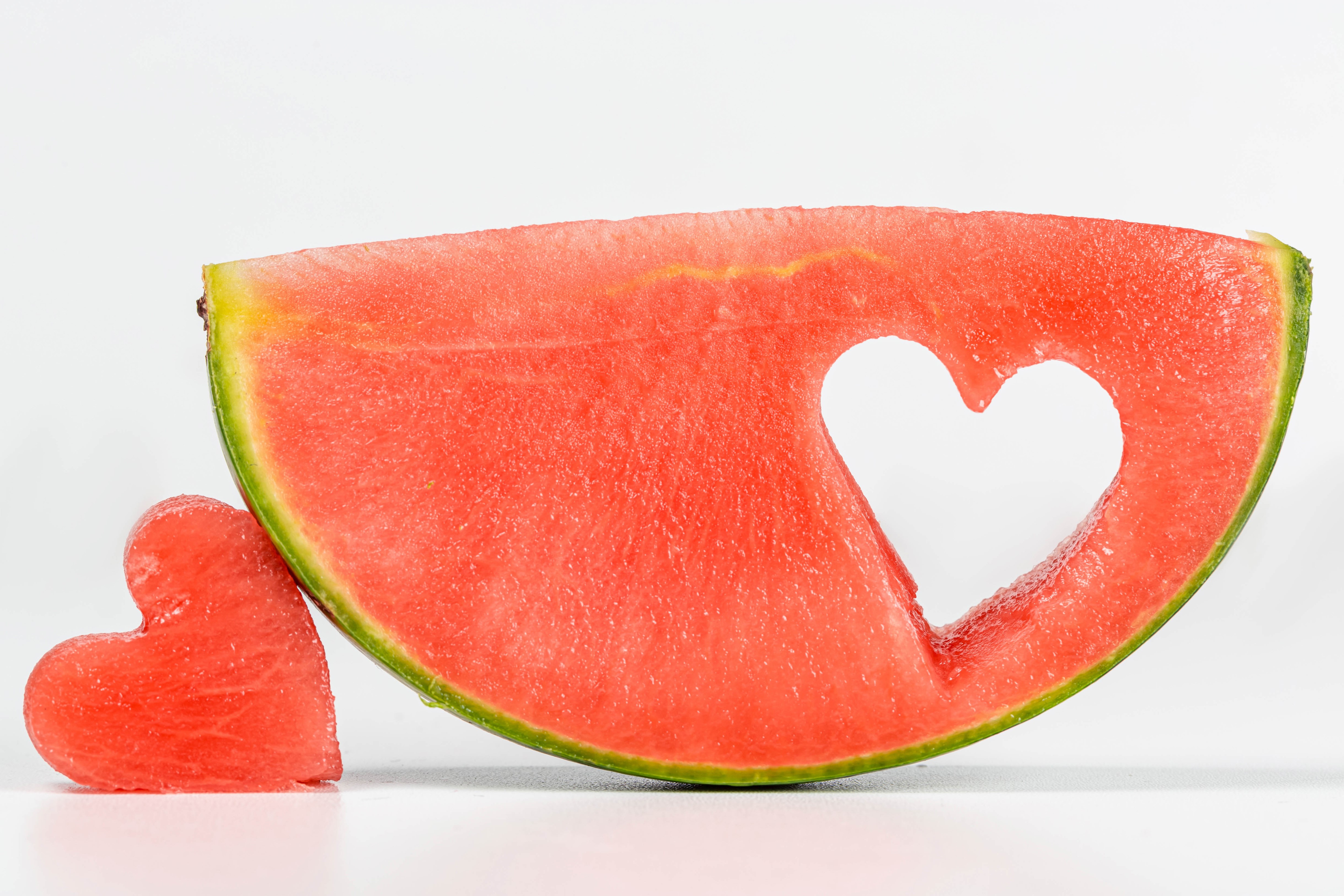 Watermelon slice with heart cut out and heart shape HD Wallpaper