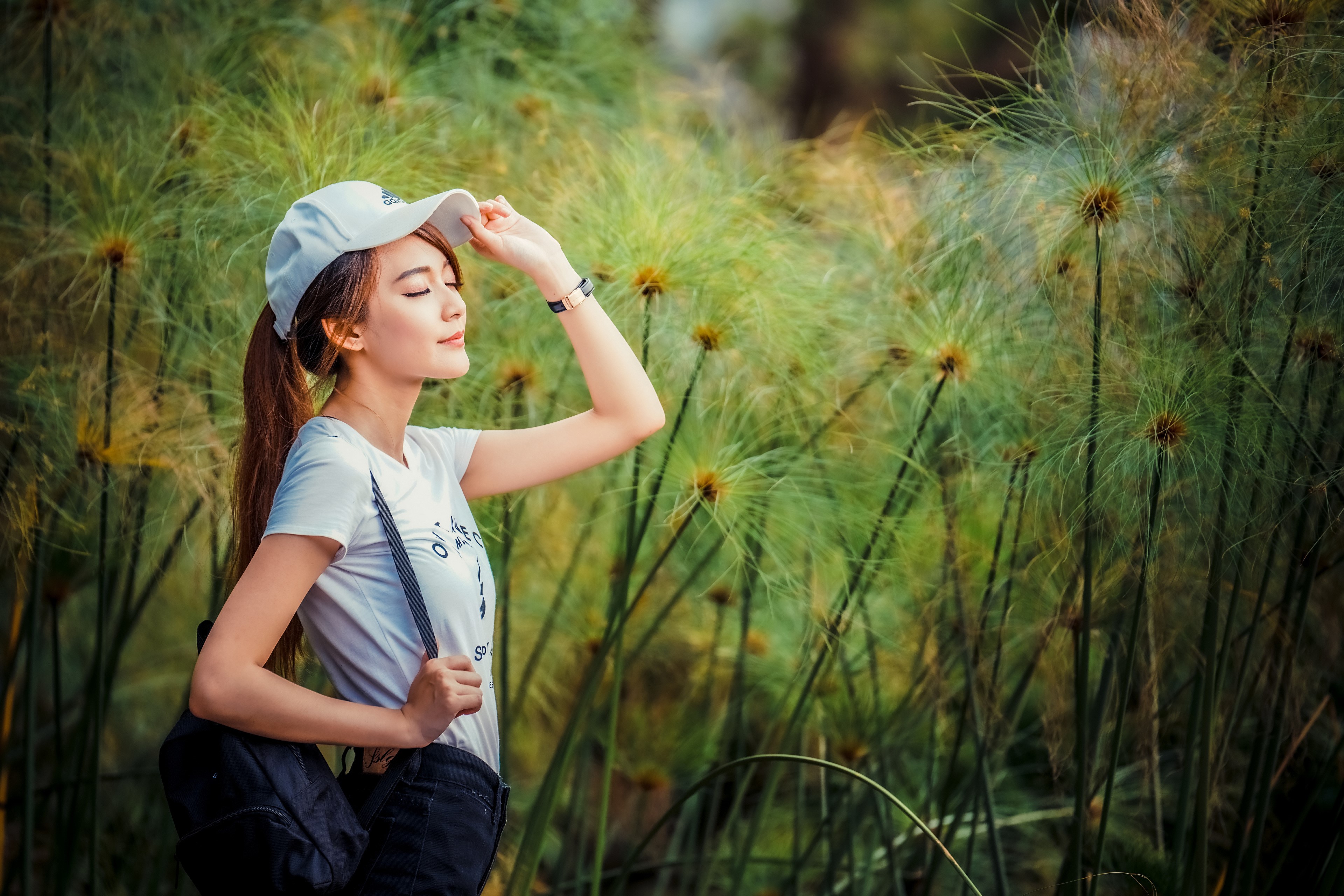Asian woman wearing a baseball cap and t-shirt HD Wallpaper