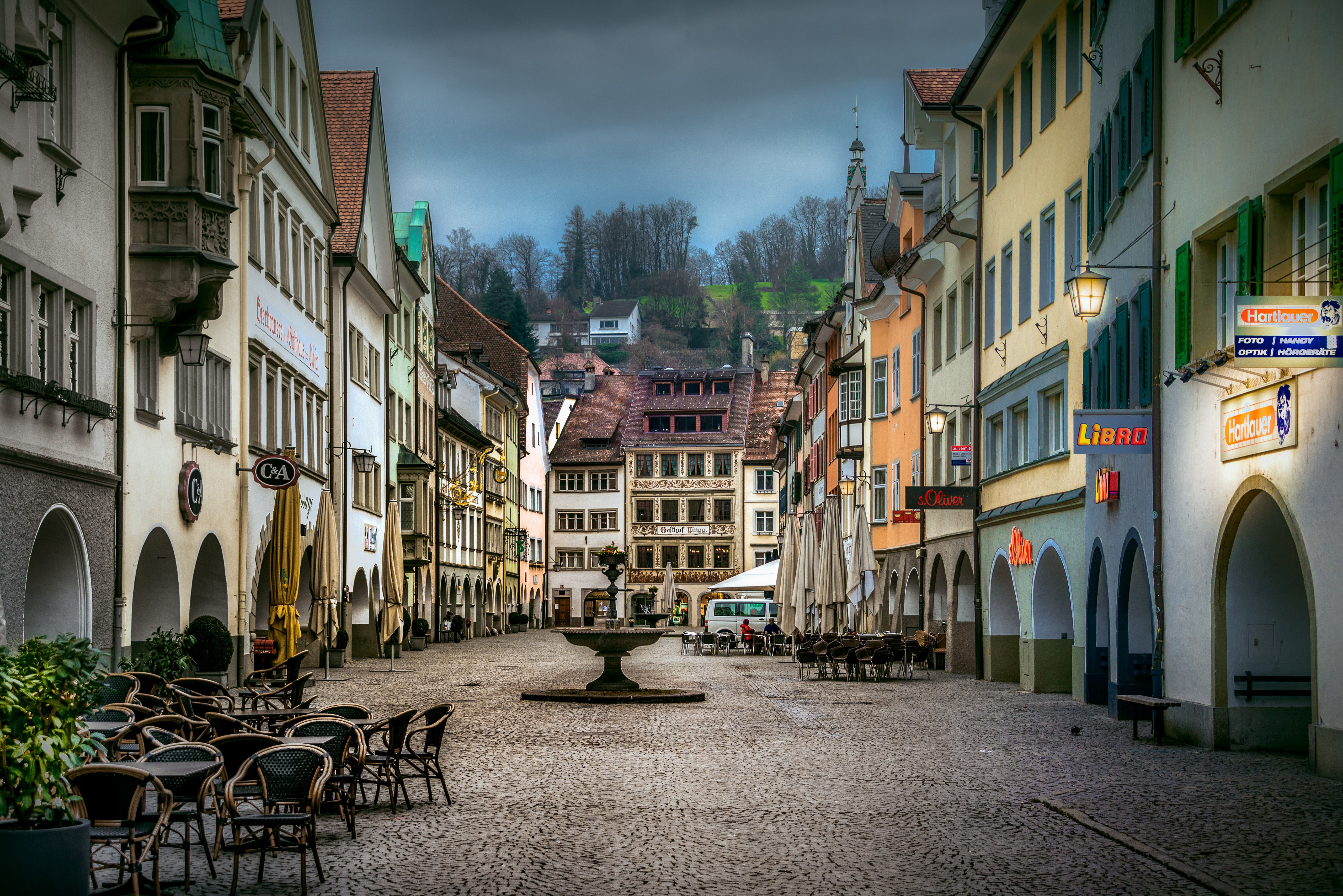Street with fountain and buildings in Feldkirch, Austria HD Wallpaper