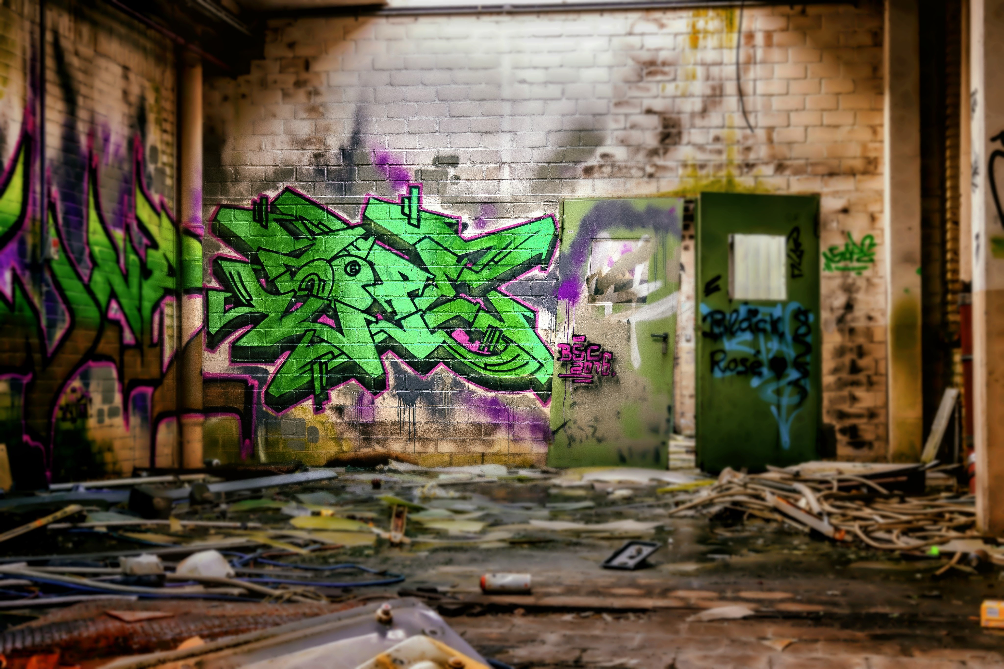 Graffiti on brick wall with doors HD Wallpaper