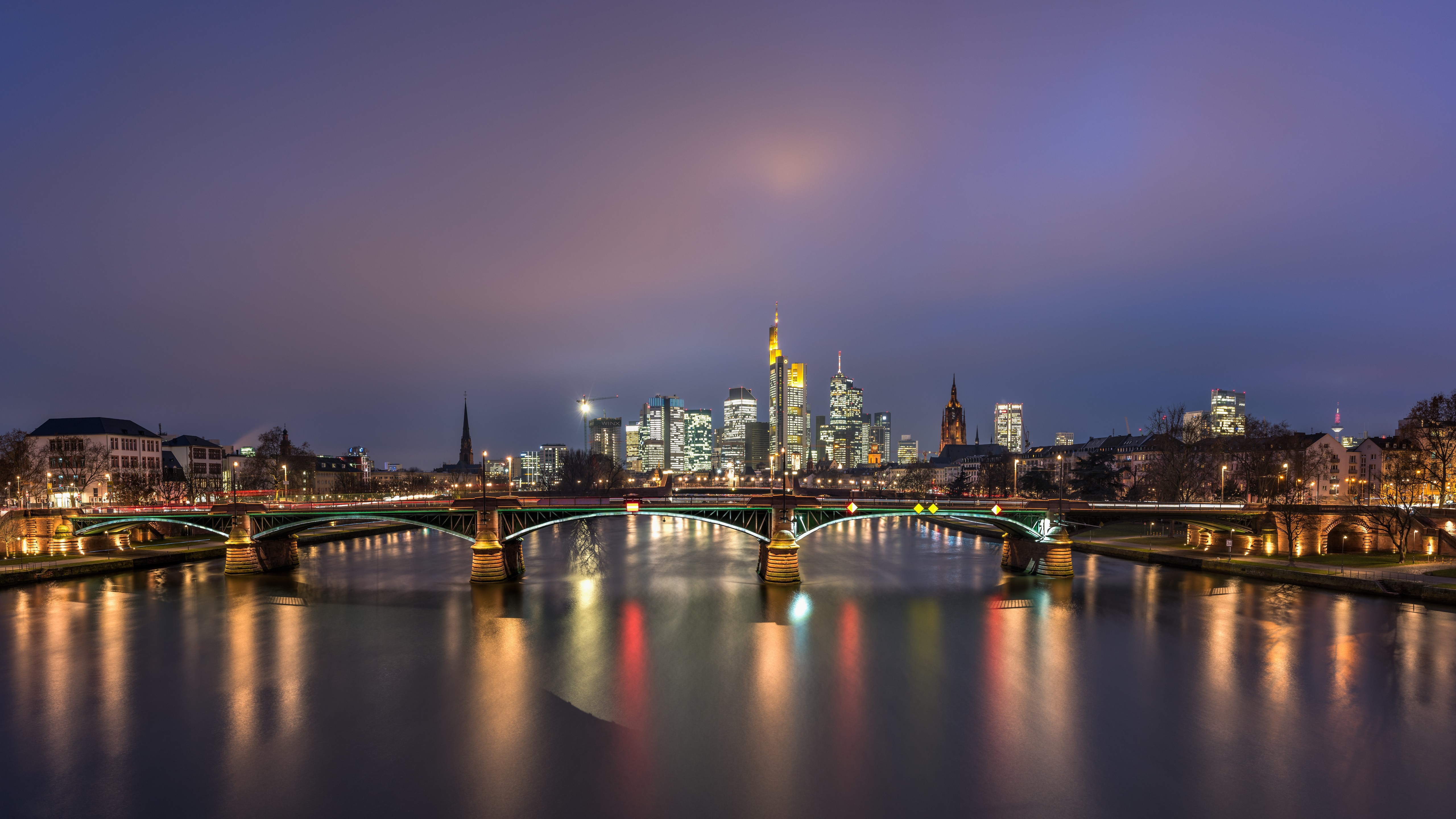 Frankfurt skyline and bridges over river at night HD Wallpaper