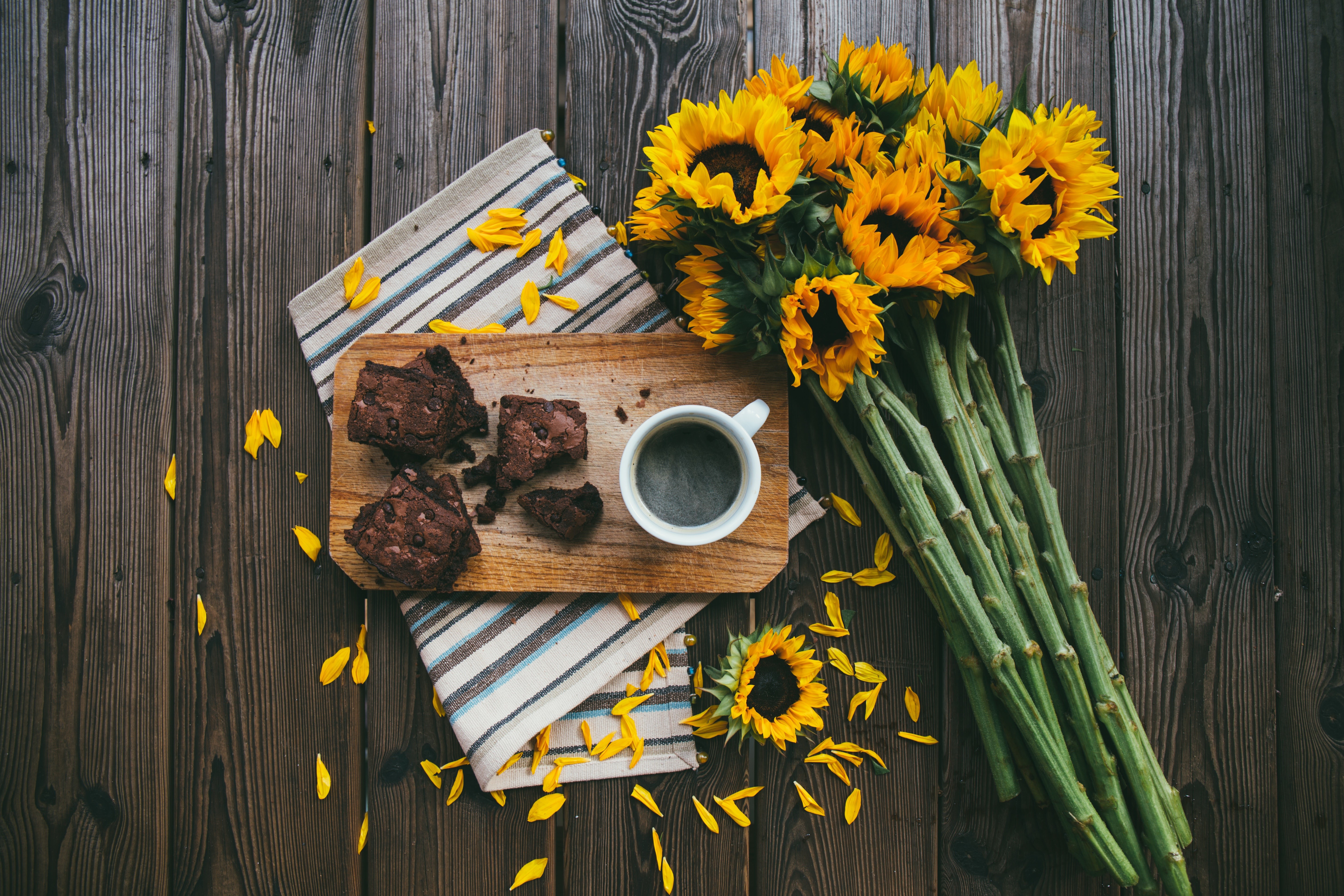 Sunflowers, Brownies, and Coffee on a Wooden Table HD Wallpaper