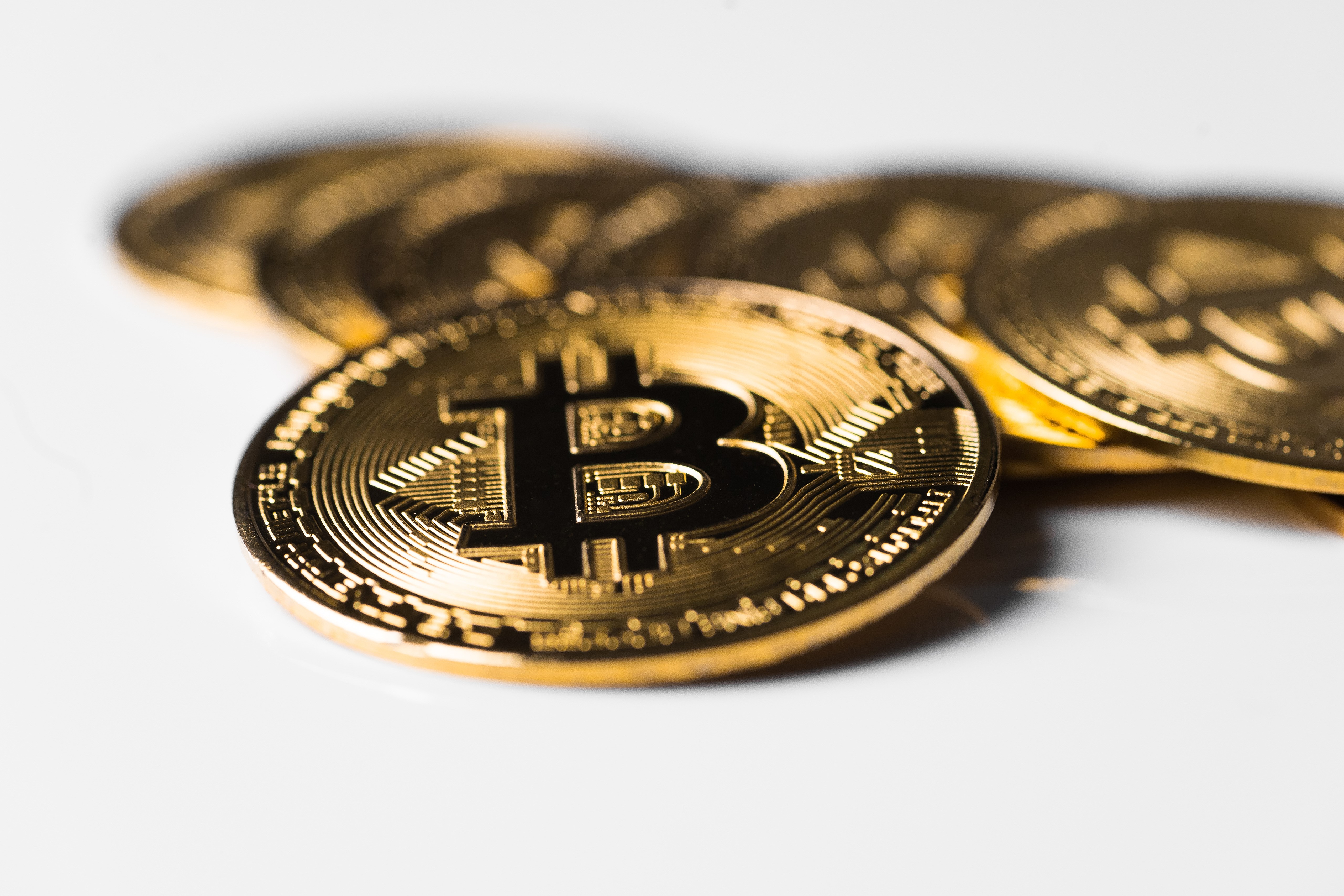 Gold Bitcoin coins with bokeh effect HD Wallpaper