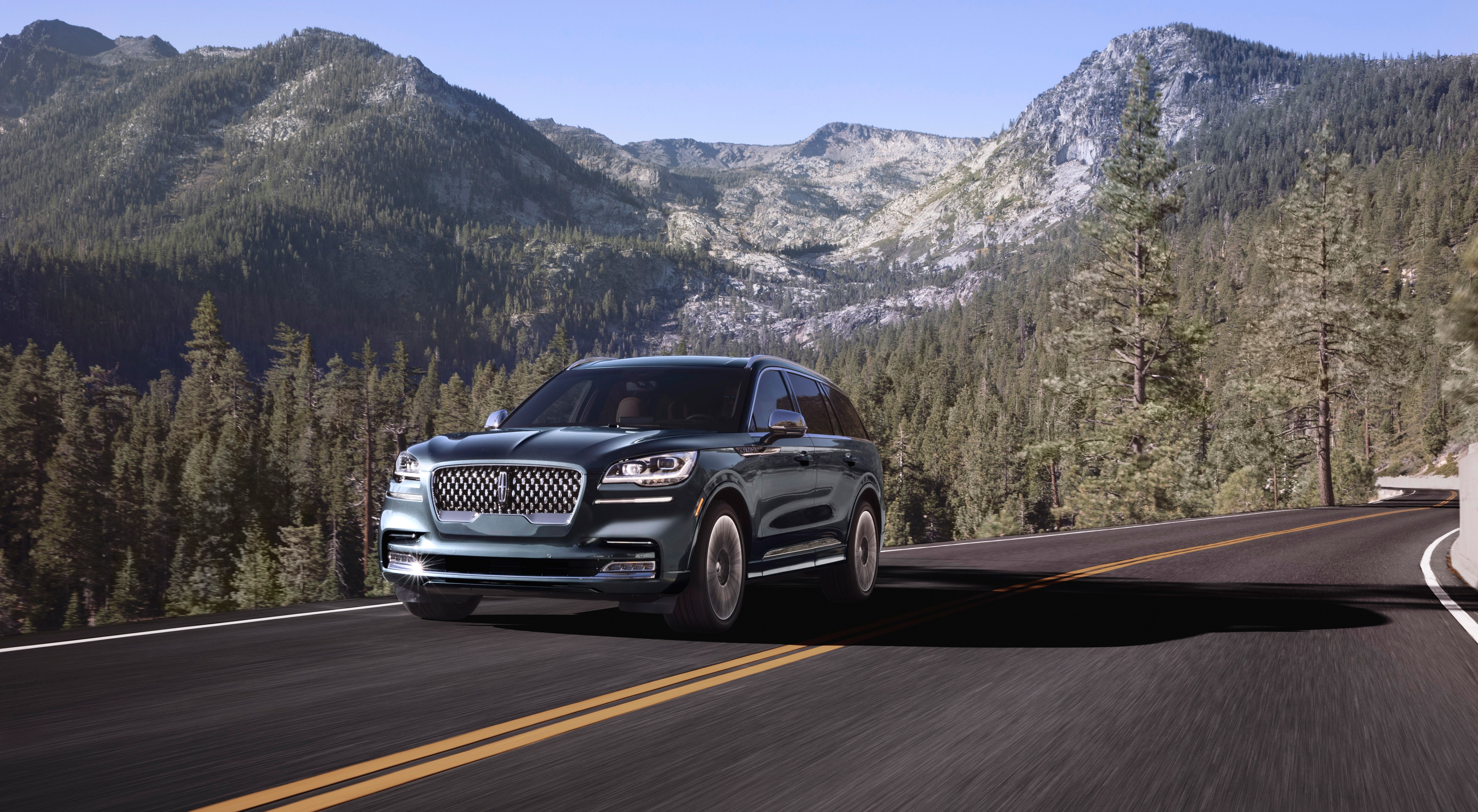 Lincoln Aviator SUV on a mountain road HD Wallpaper