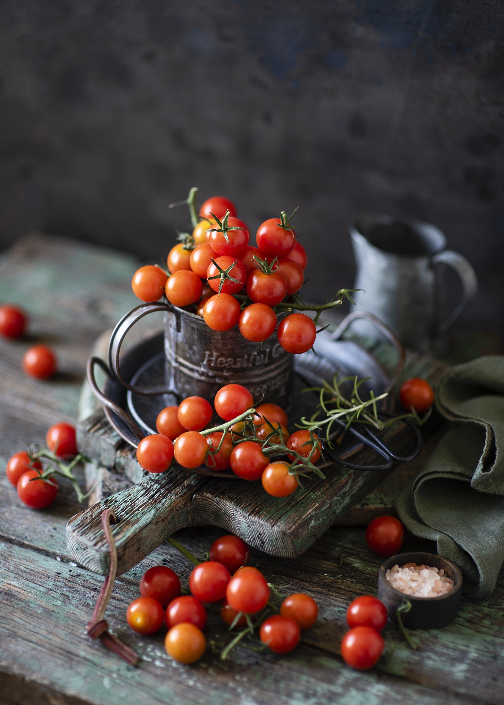 Cherry tomatoes on branches in a rustic setting HD Phone Wallpaper