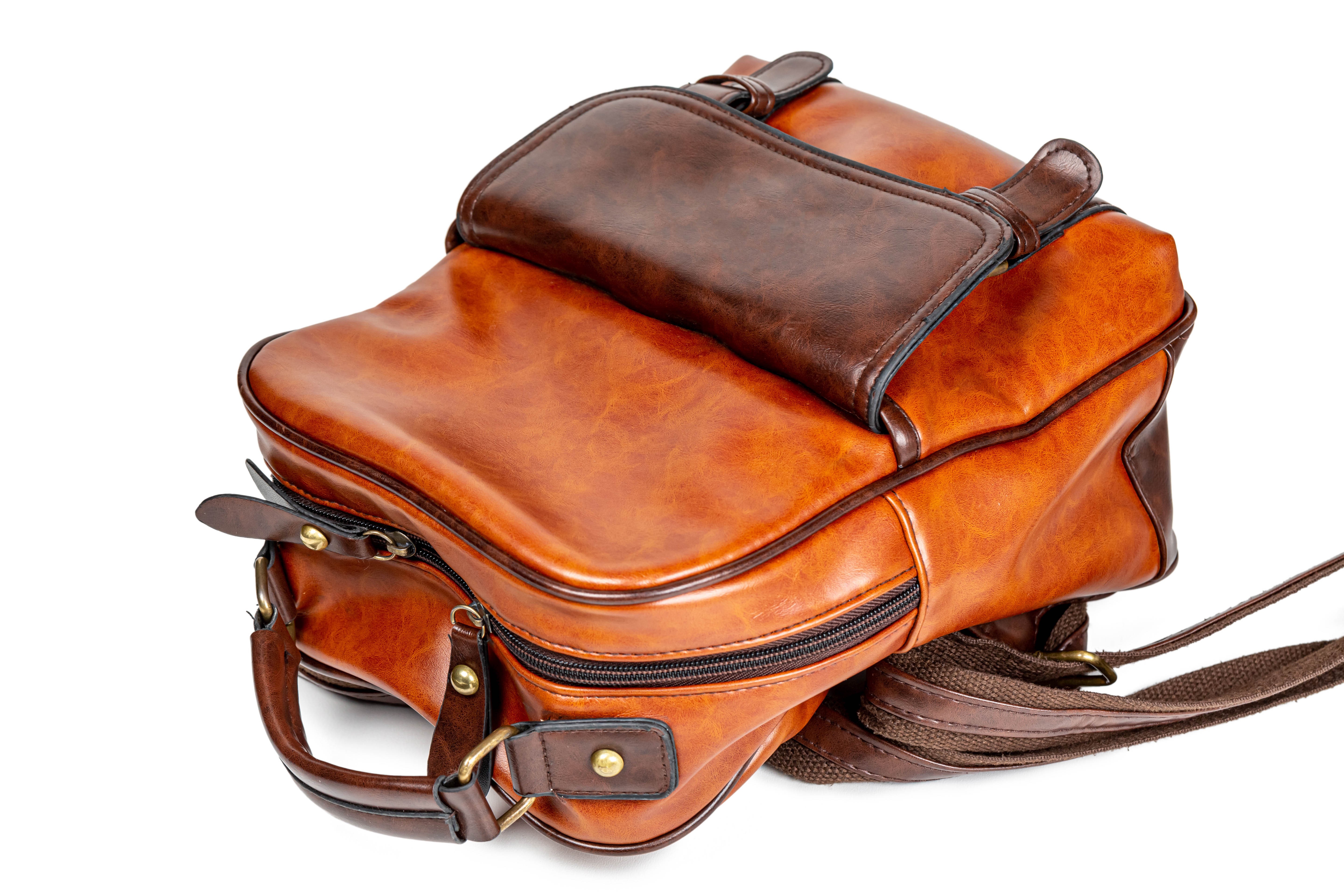 Brown leather backpack on white background HD Wallpaper