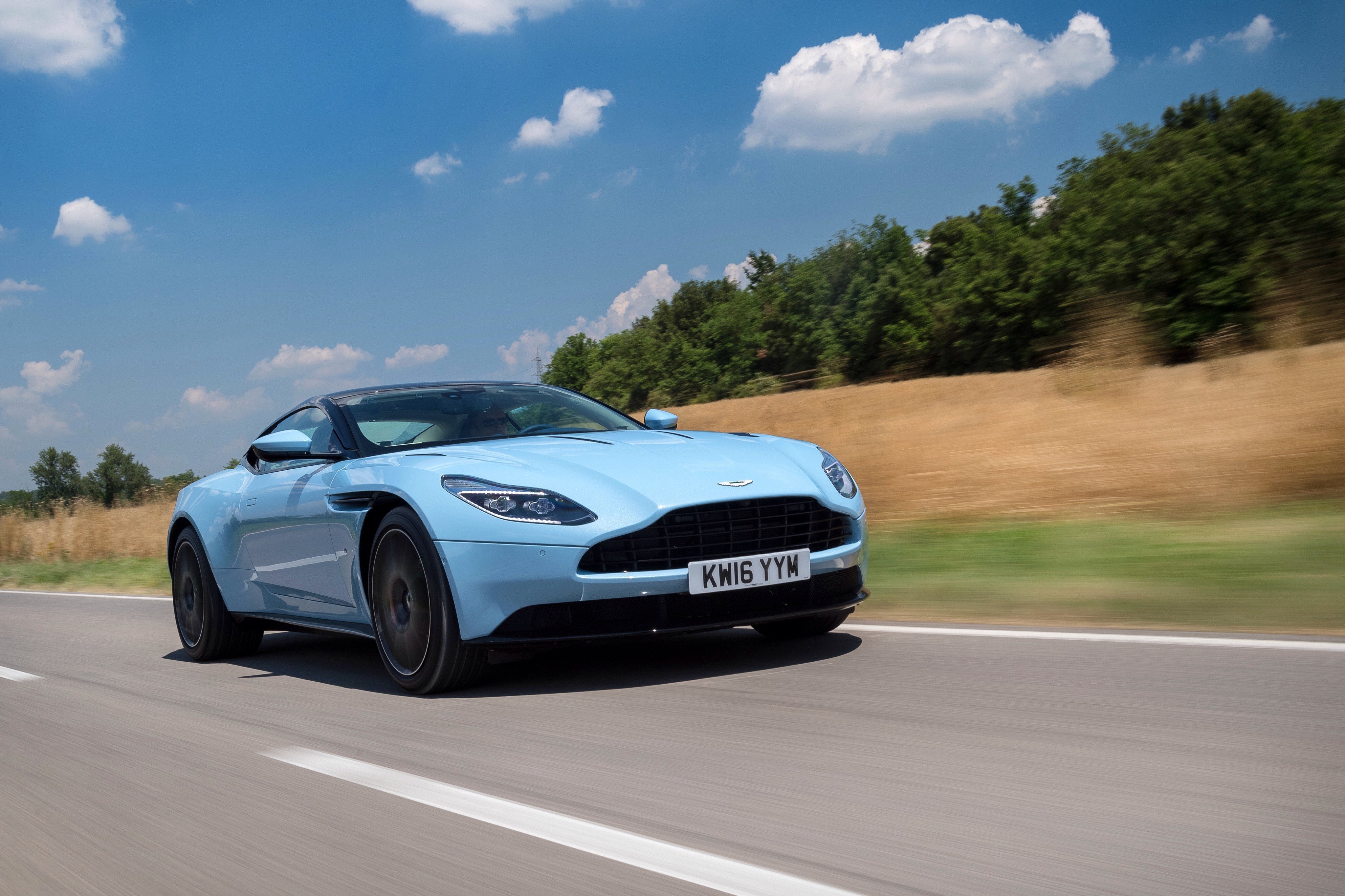 Light Blue Aston Martin DB11 Convertible Driving on Road HD Wallpaper