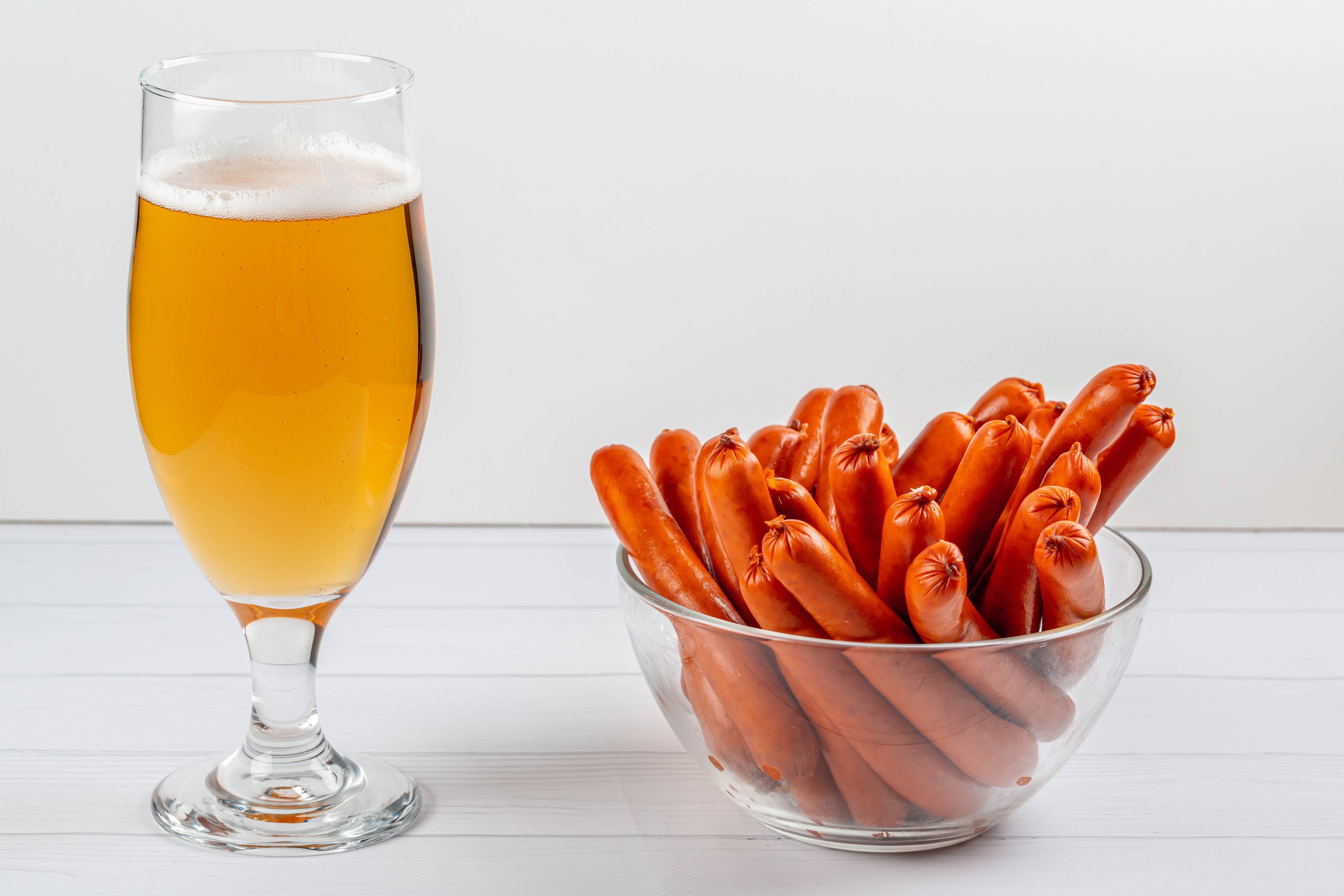 Glass of Beer and Bowl of Vienna Sausages HD Wallpaper