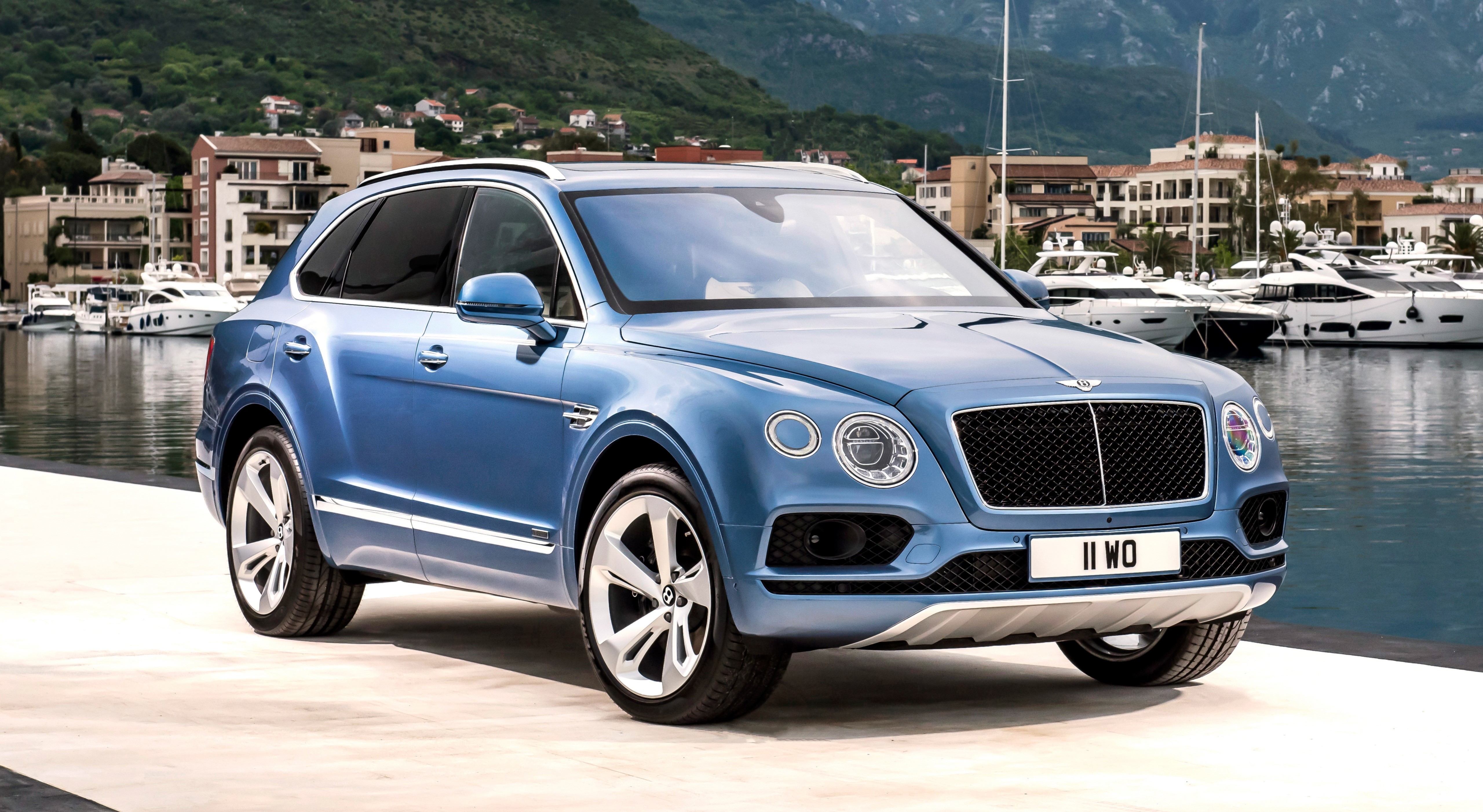 Blue Bentley Bentayga parked by a marina HD Wallpaper