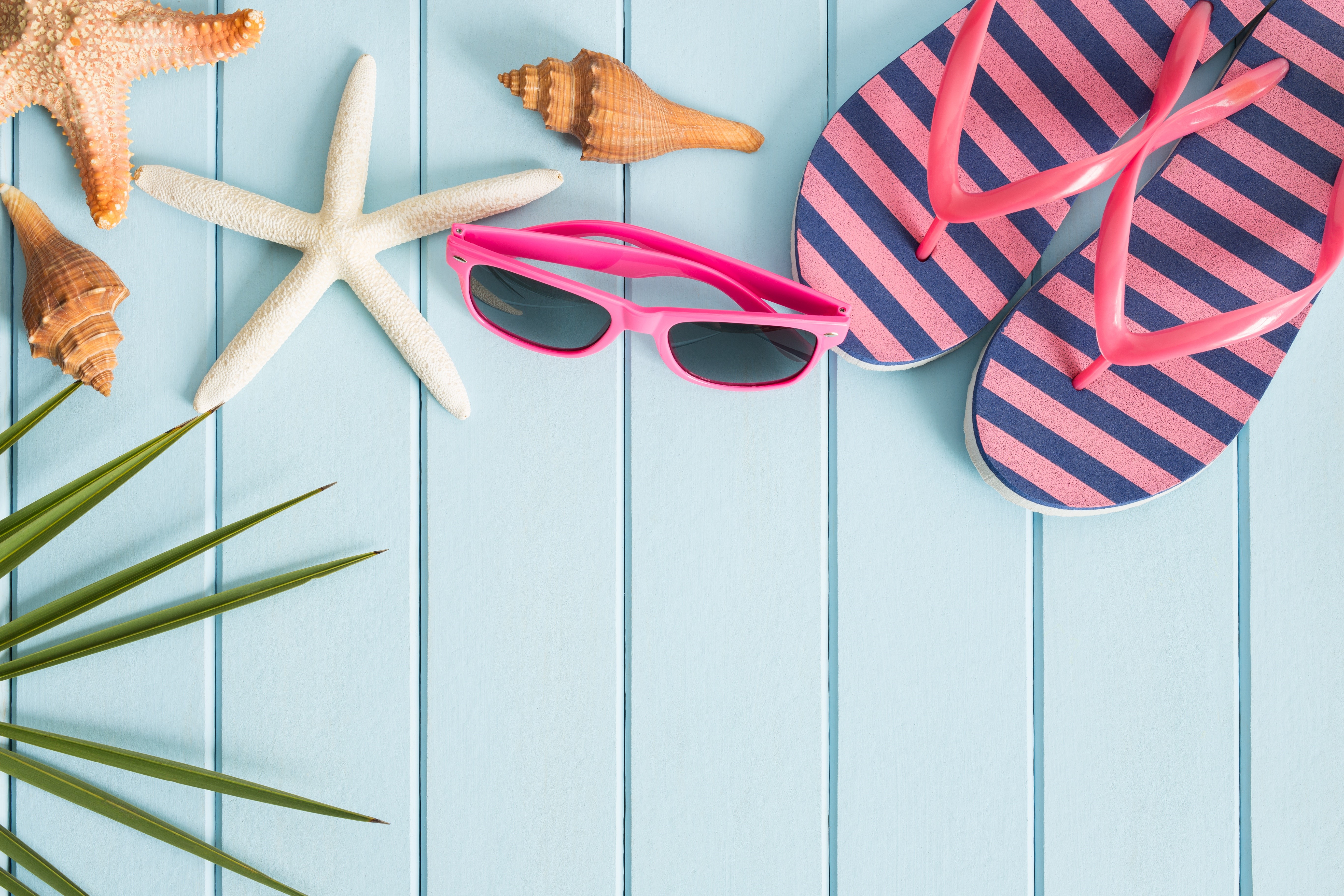 Summer beach accessories on blue wooden planks HD Wallpaper