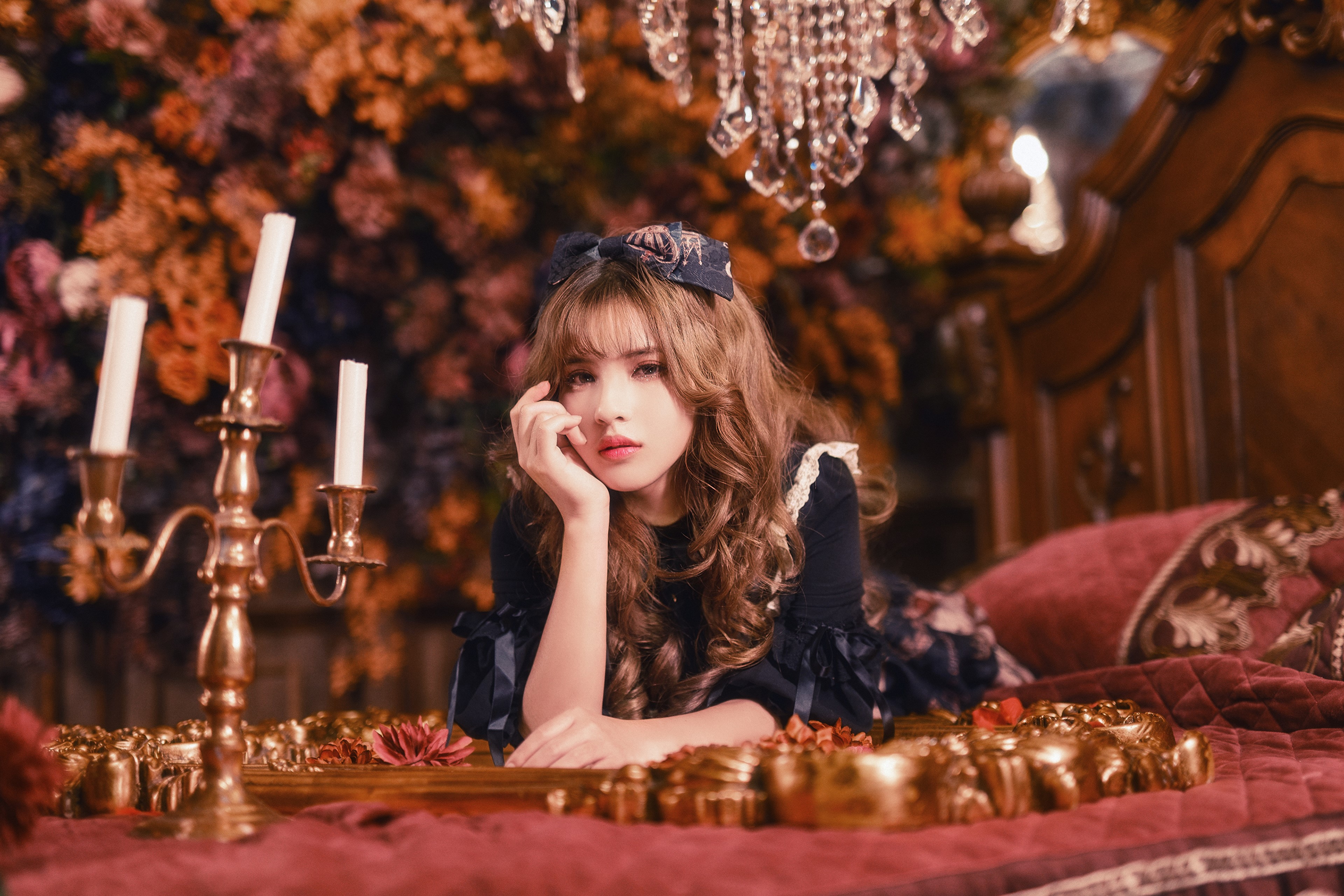4K Portrait of a Brown-Haired Woman with Candles HD Wallpaper