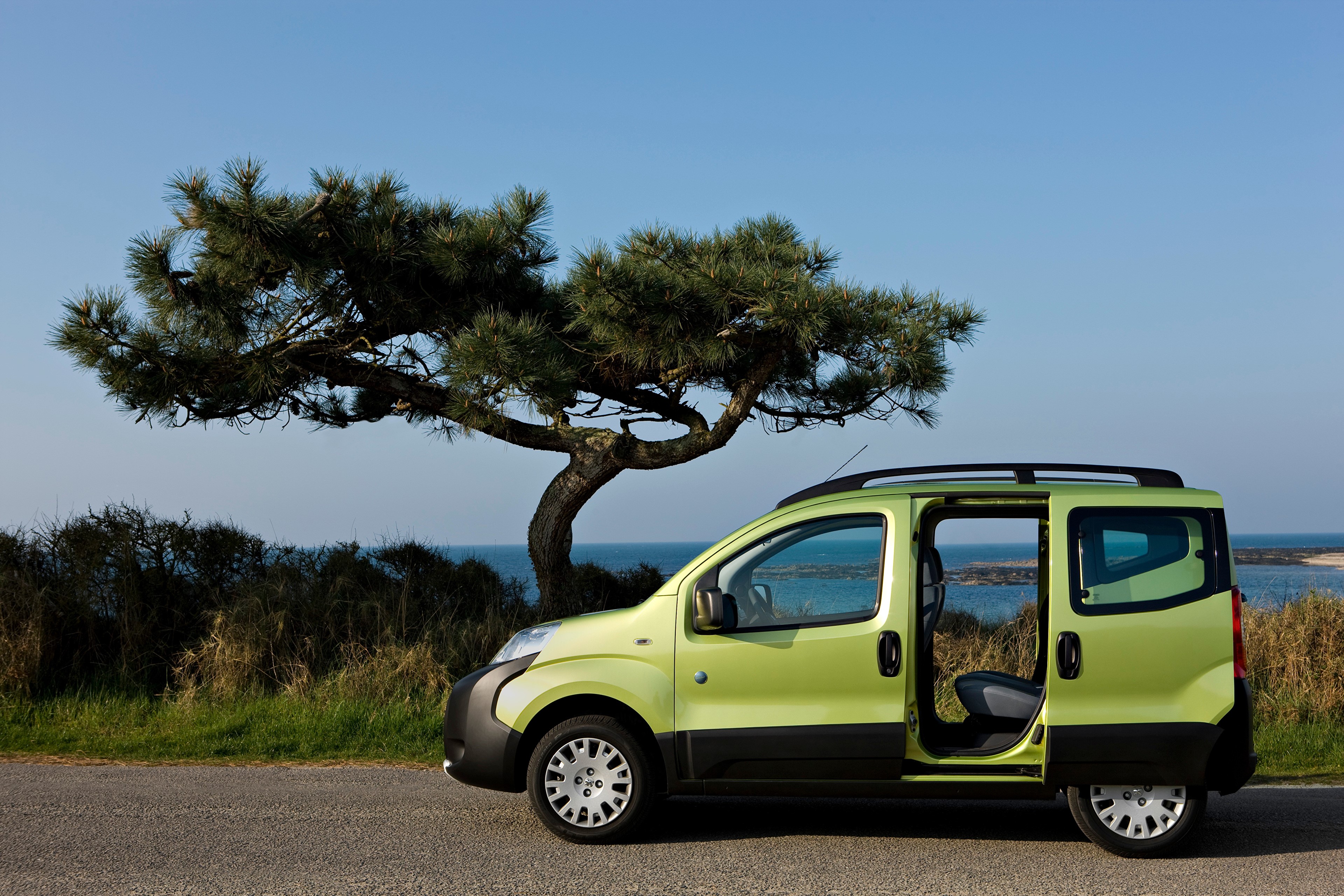Green Peugeot Minivan with Opened Door by the Sea HD Wallpaper