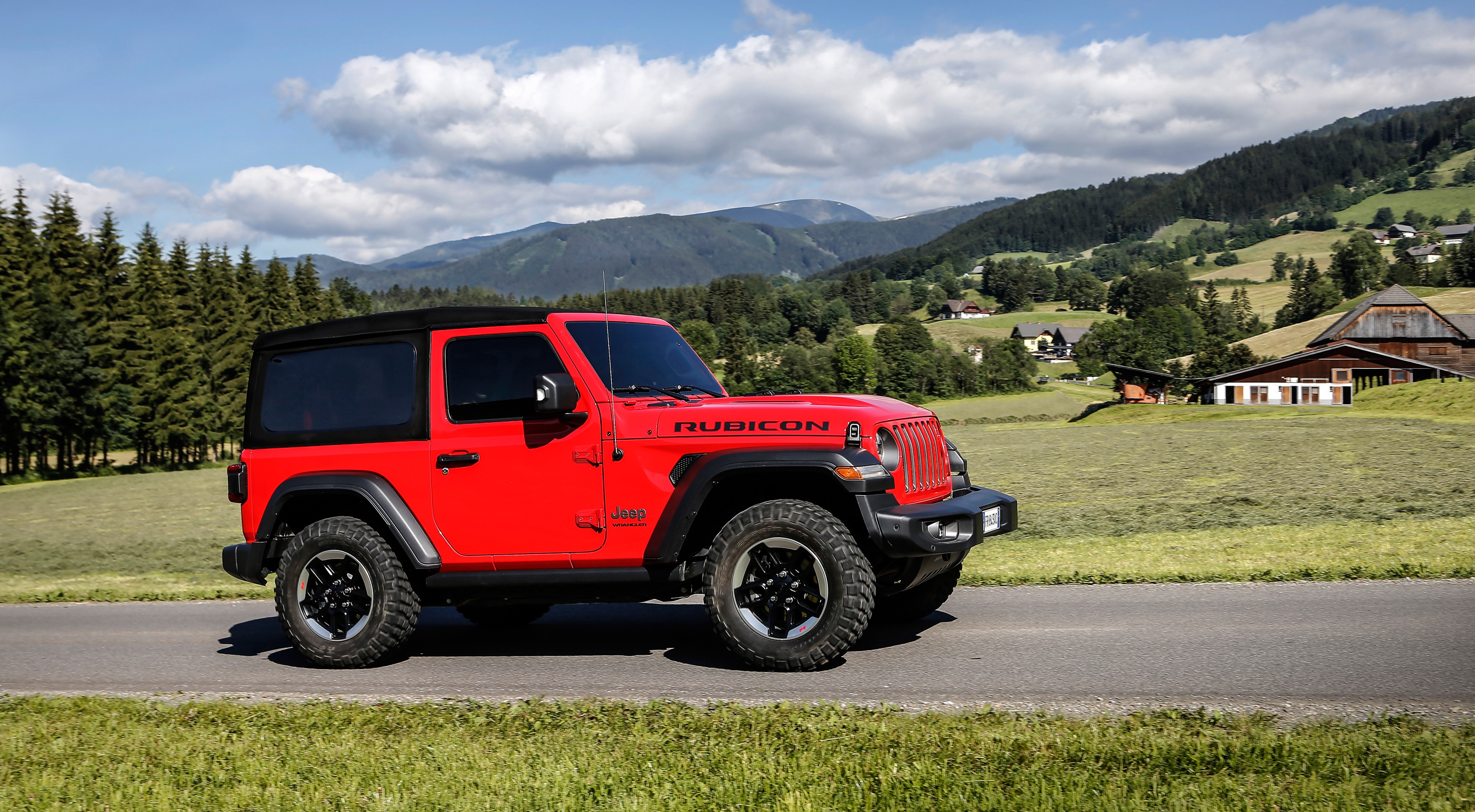 Red Jeep Wrangler Rubicon SUV on a road HD Wallpaper