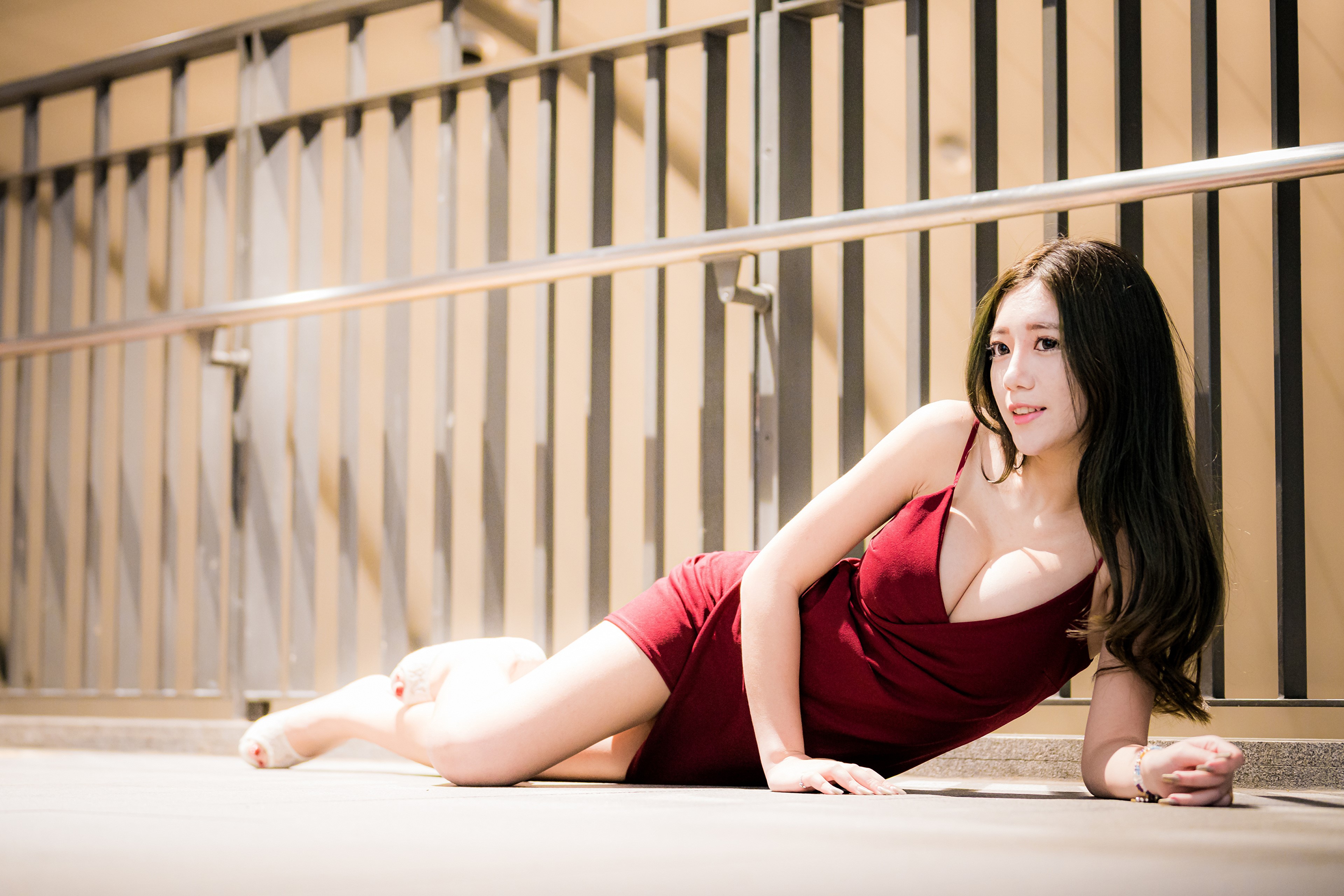 Asian woman in red dress lying down HD Wallpaper
