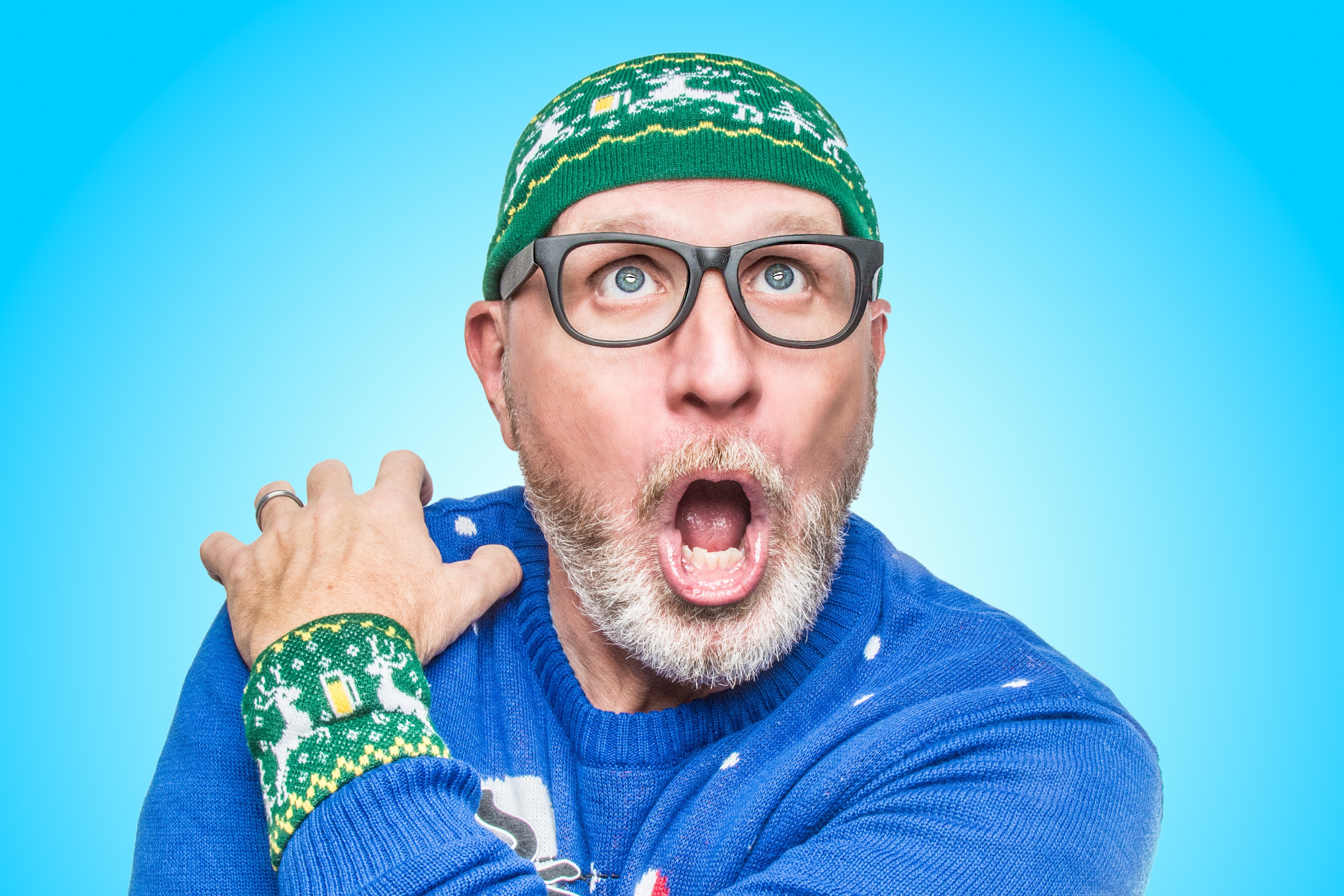Man in a Christmas sweater and hat with glasses HD Wallpaper