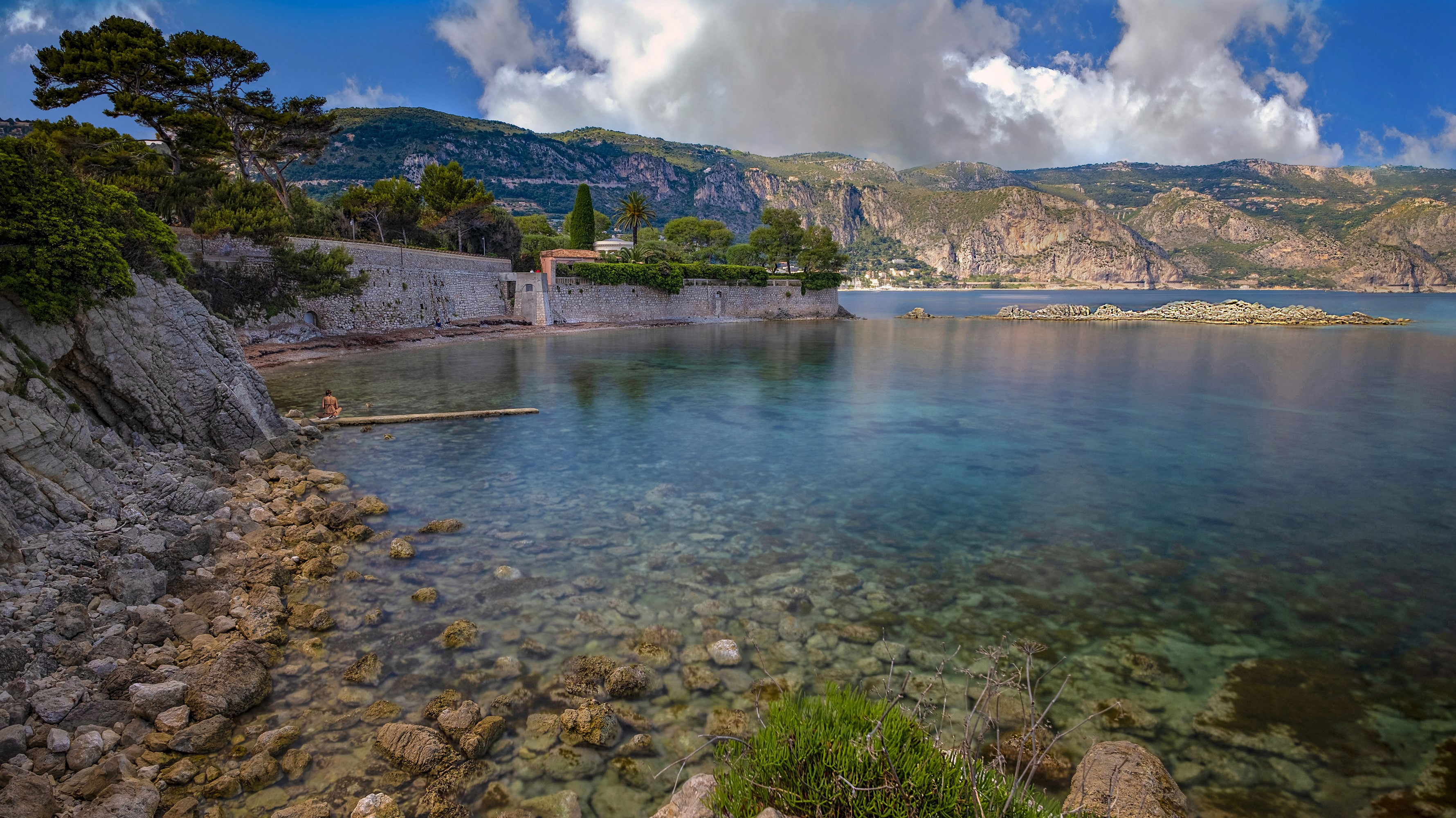 Person on dock in Saint Jean Cap Ferrat bay, France HD Wallpaper