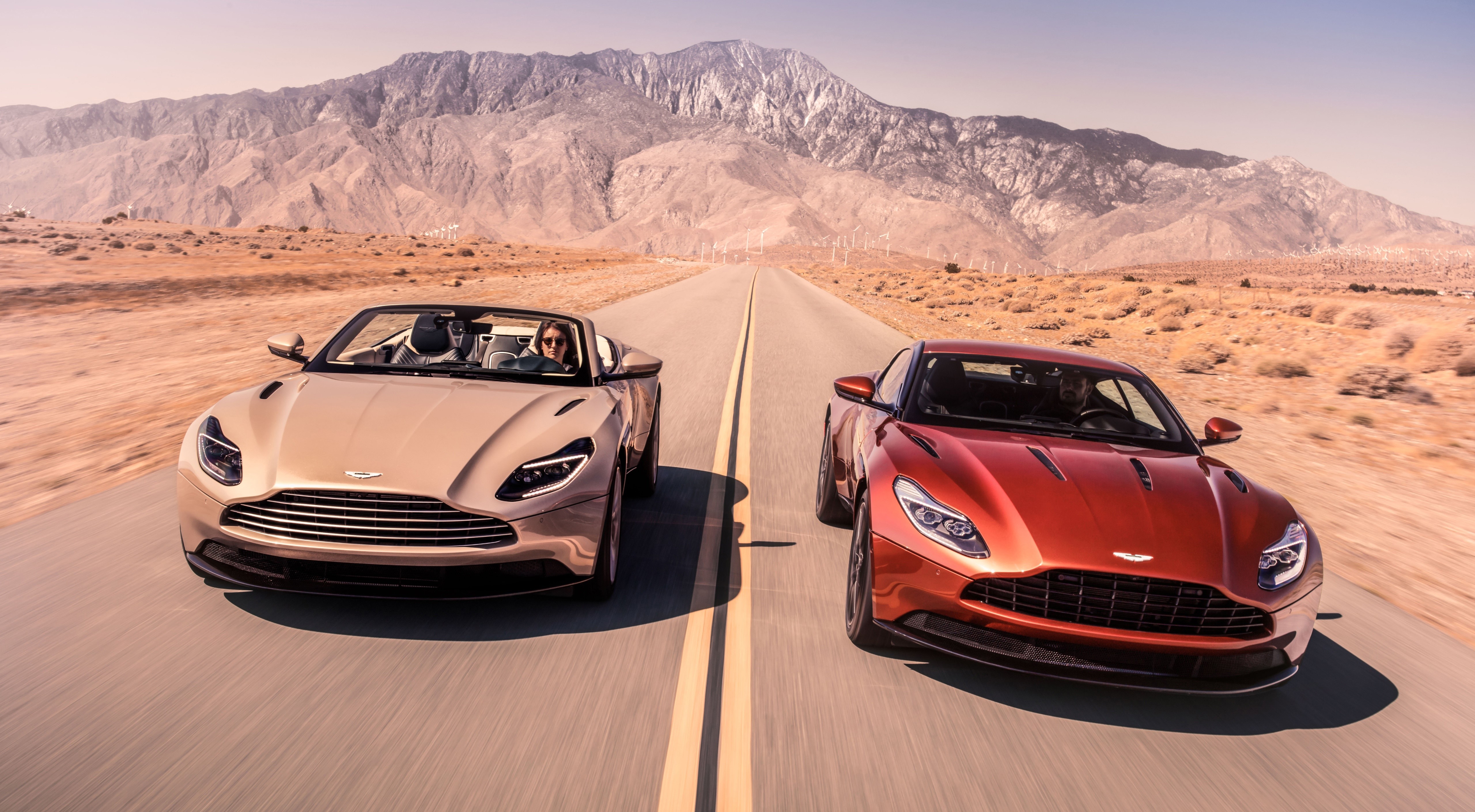 Two Aston Martin DB11 V8 Volante cars in motion HD Wallpaper