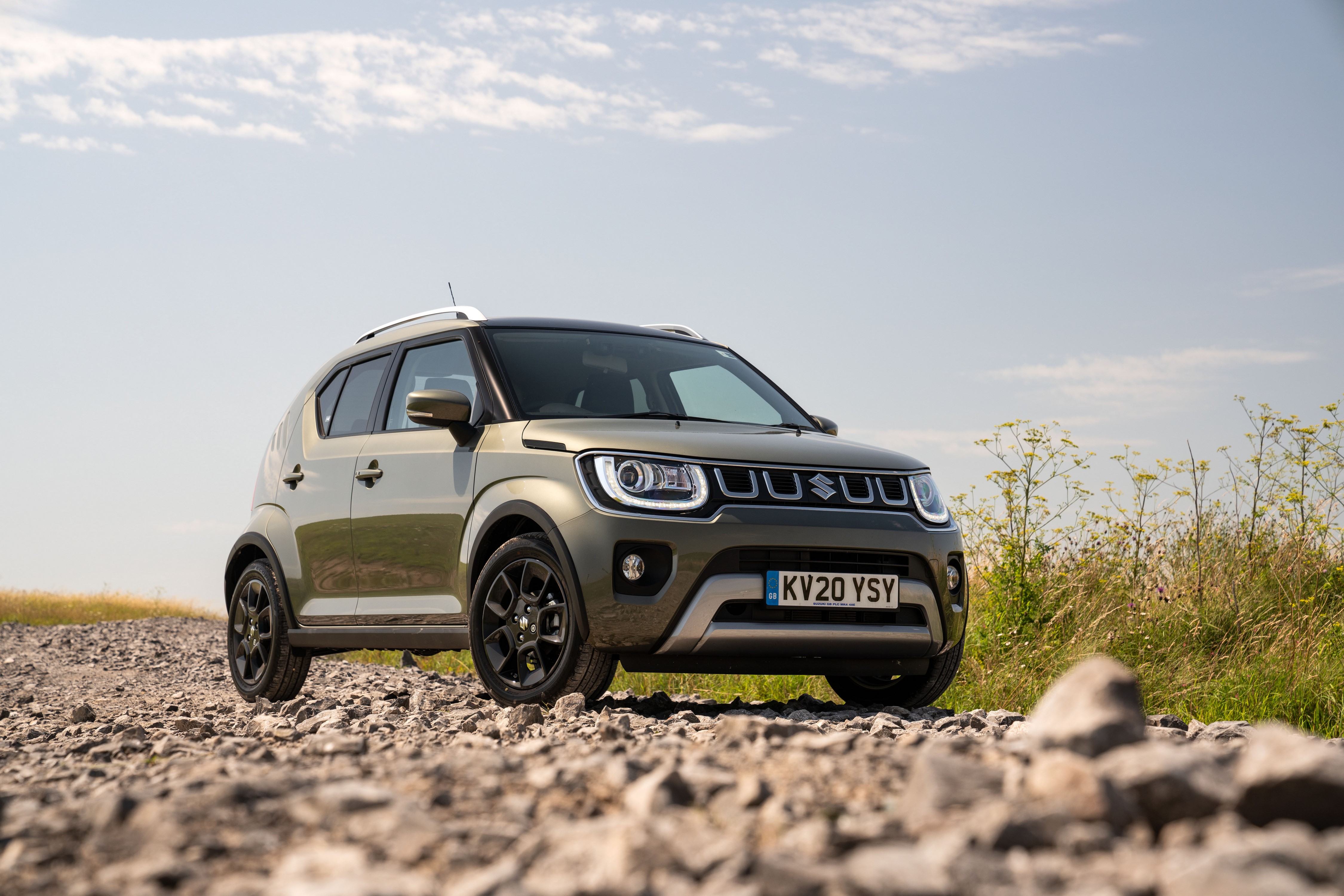 Suzuki Ignis Hybrid AllGrip on a gravel road HD Wallpaper