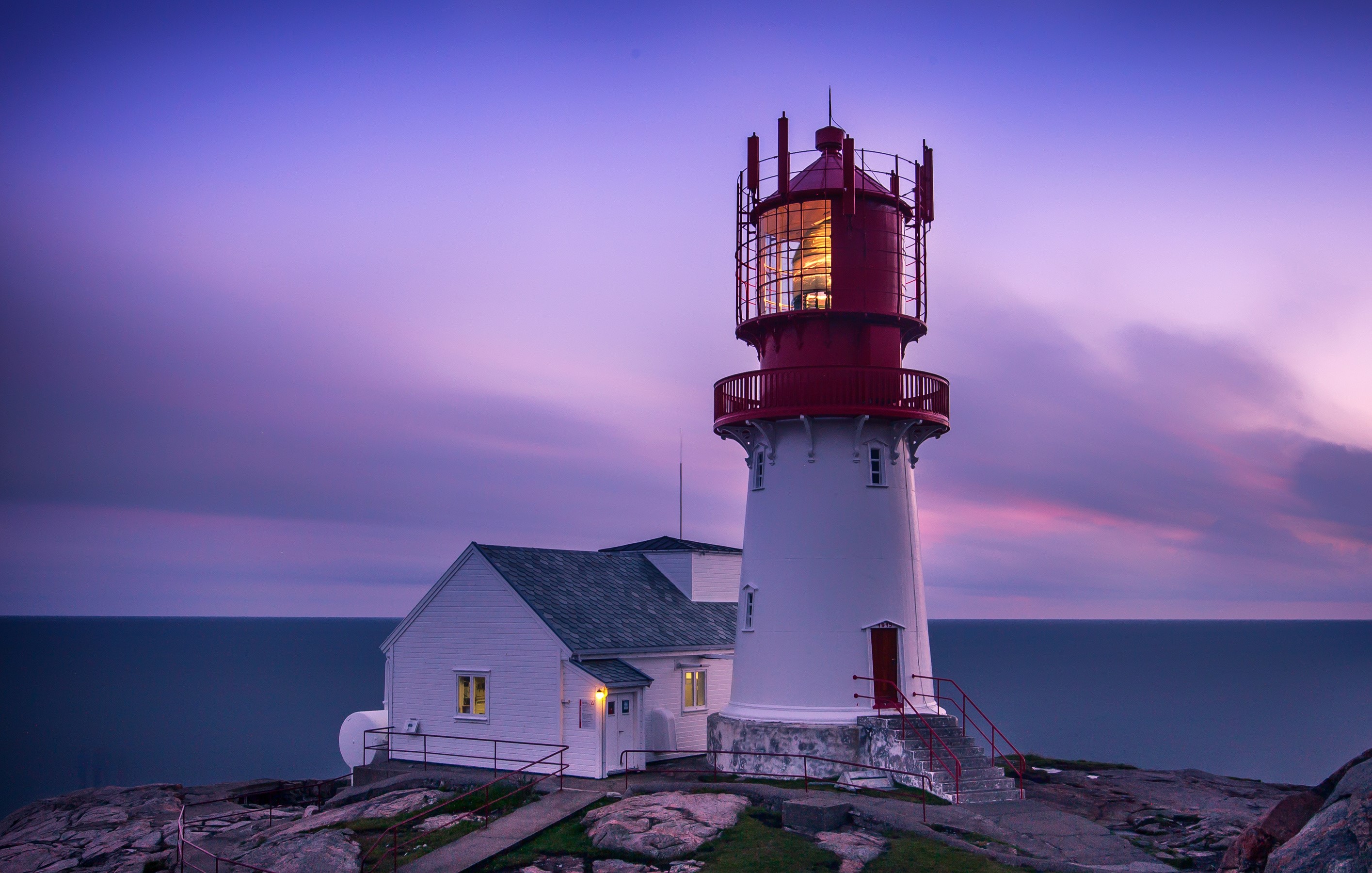 Lighthouse on the coast of Norway at dusk HD Wallpaper