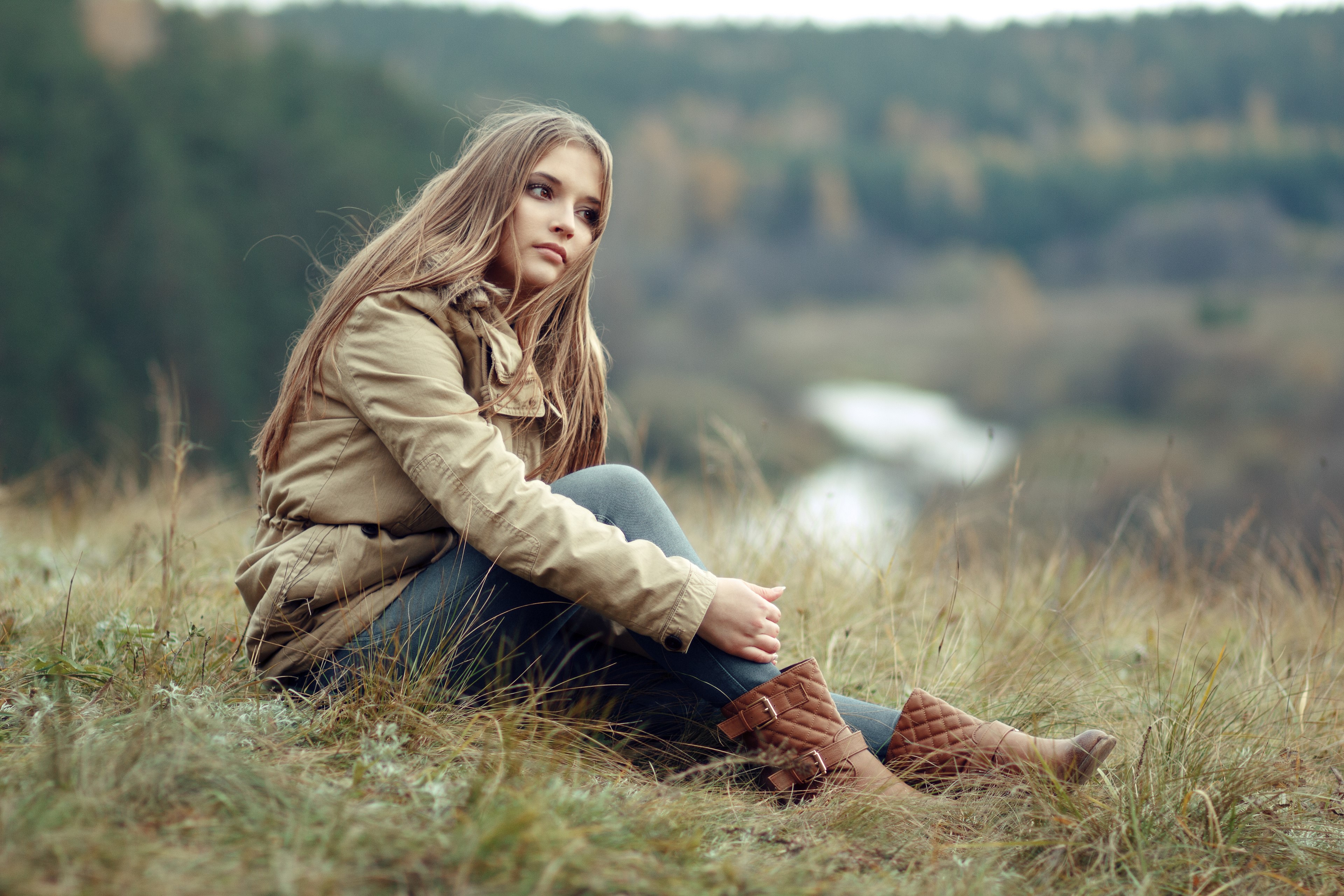 4K Dasha sitting on grass wearing a jacket HD Wallpaper
