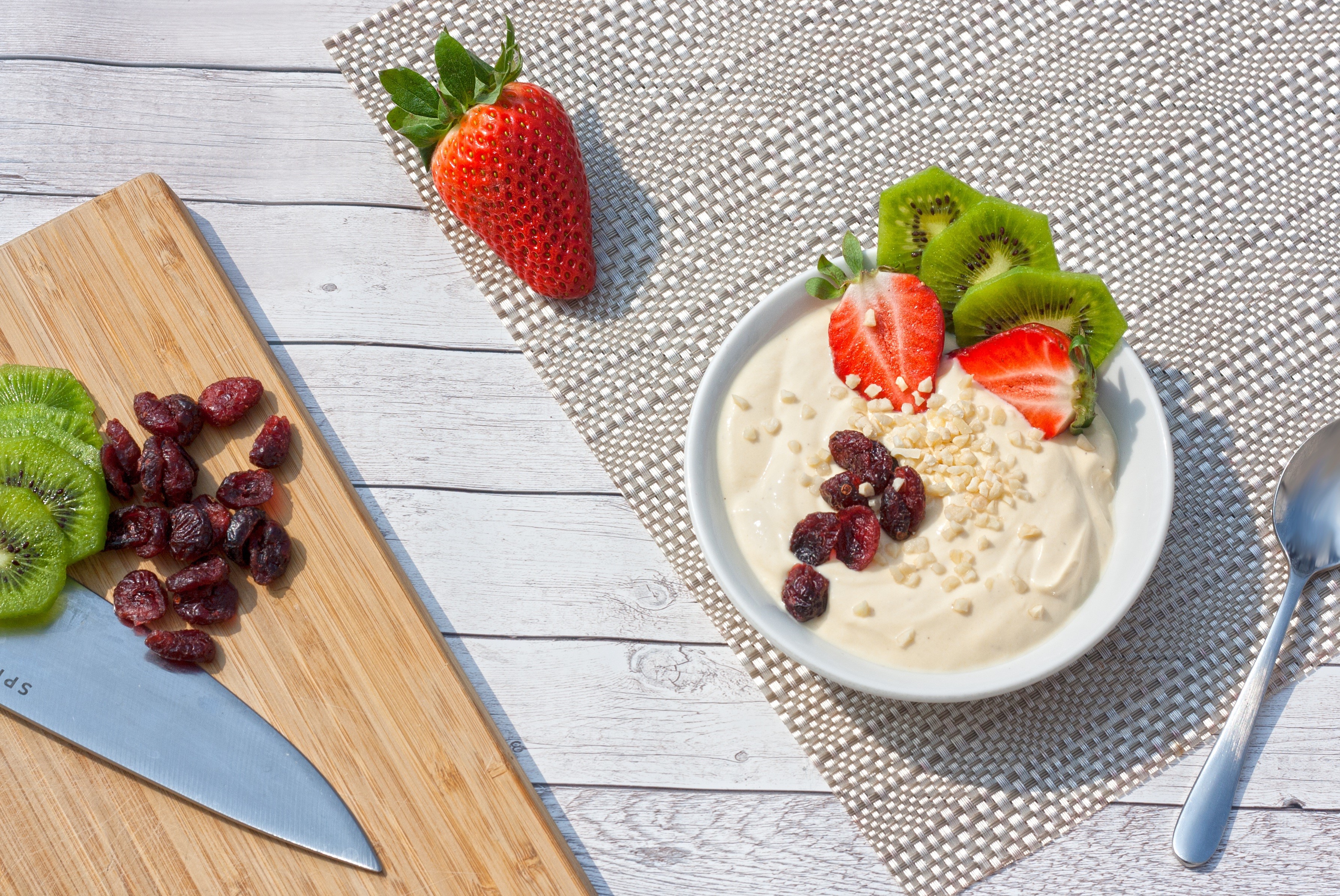 Yogurt bowl with strawberries, kiwi, and cranberries HD Wallpaper