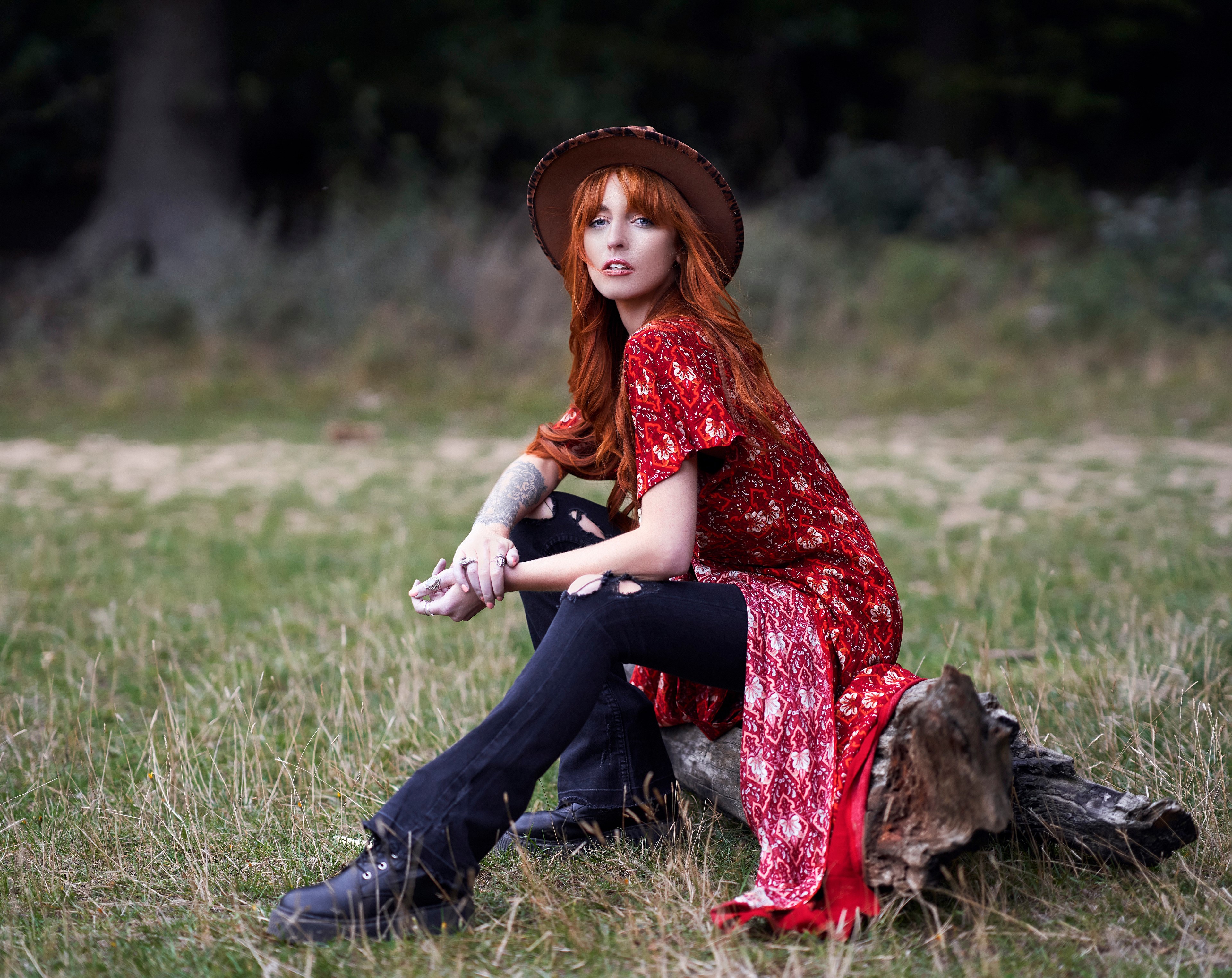 Redhead girl in hat and dress sitting on log HD Wallpaper