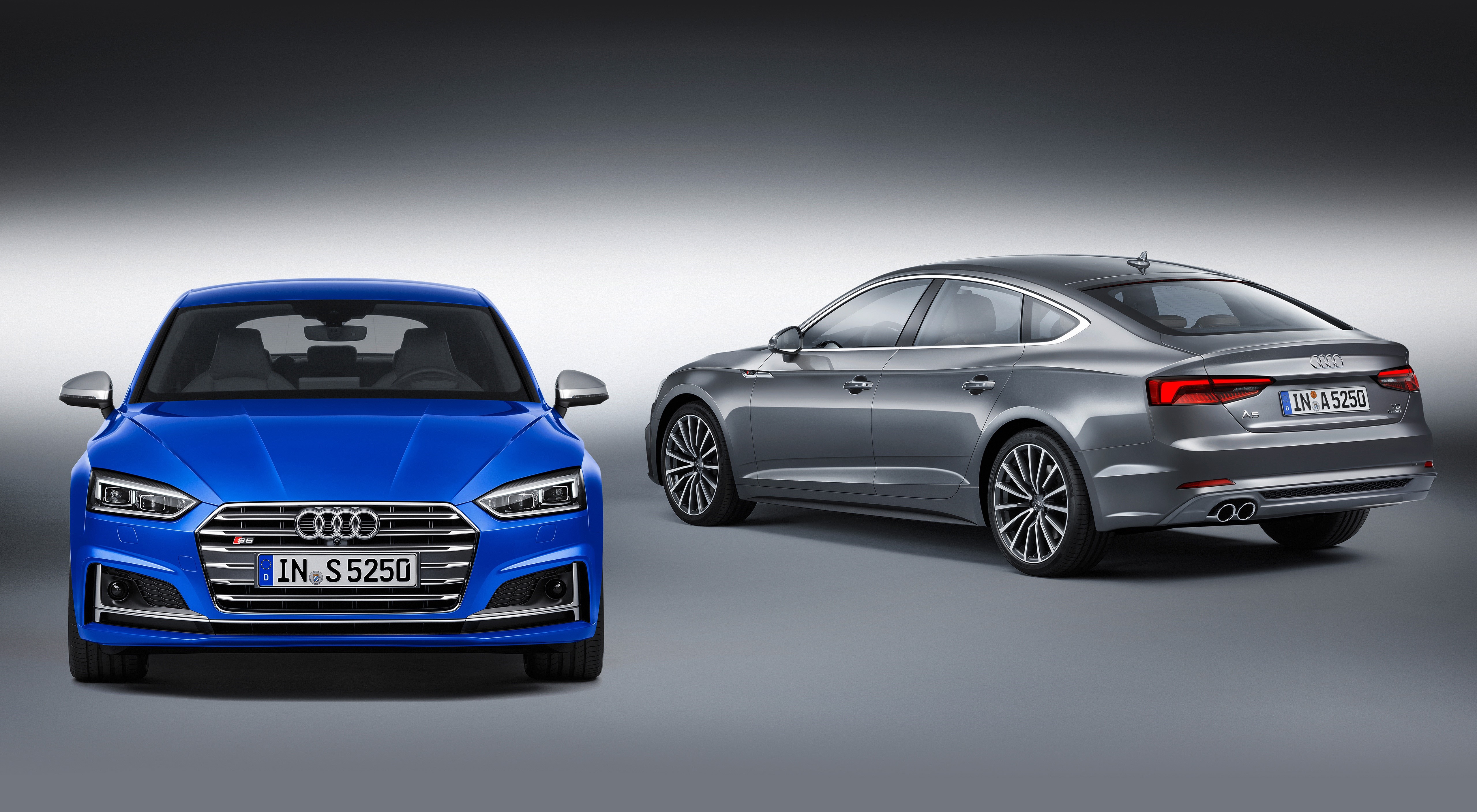 Two Audi S5 Sportback cars, blue and grey HD Wallpaper