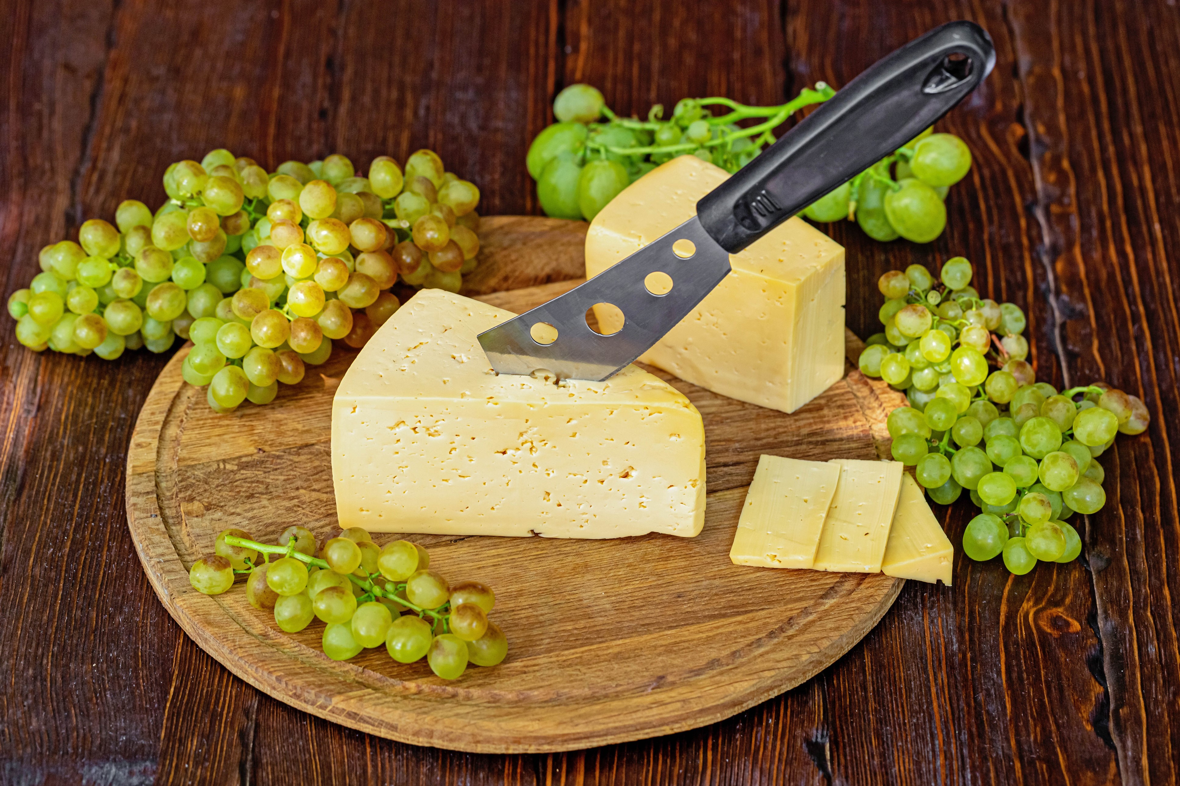 Cheese and Grapes on a Cutting Board with Knife HD Wallpaper