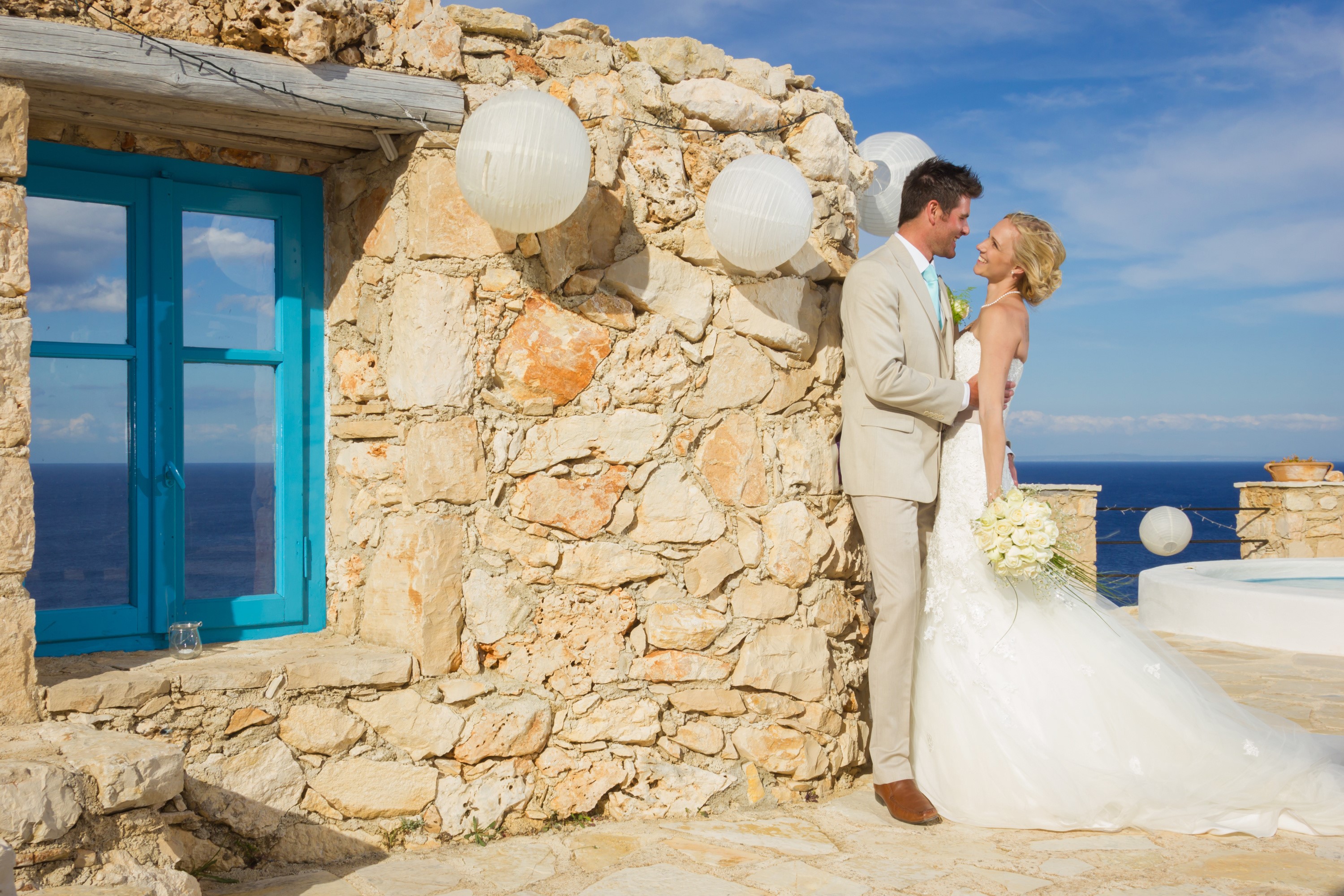 Bride and Groom on a stone terrace by the sea HD Wallpaper
