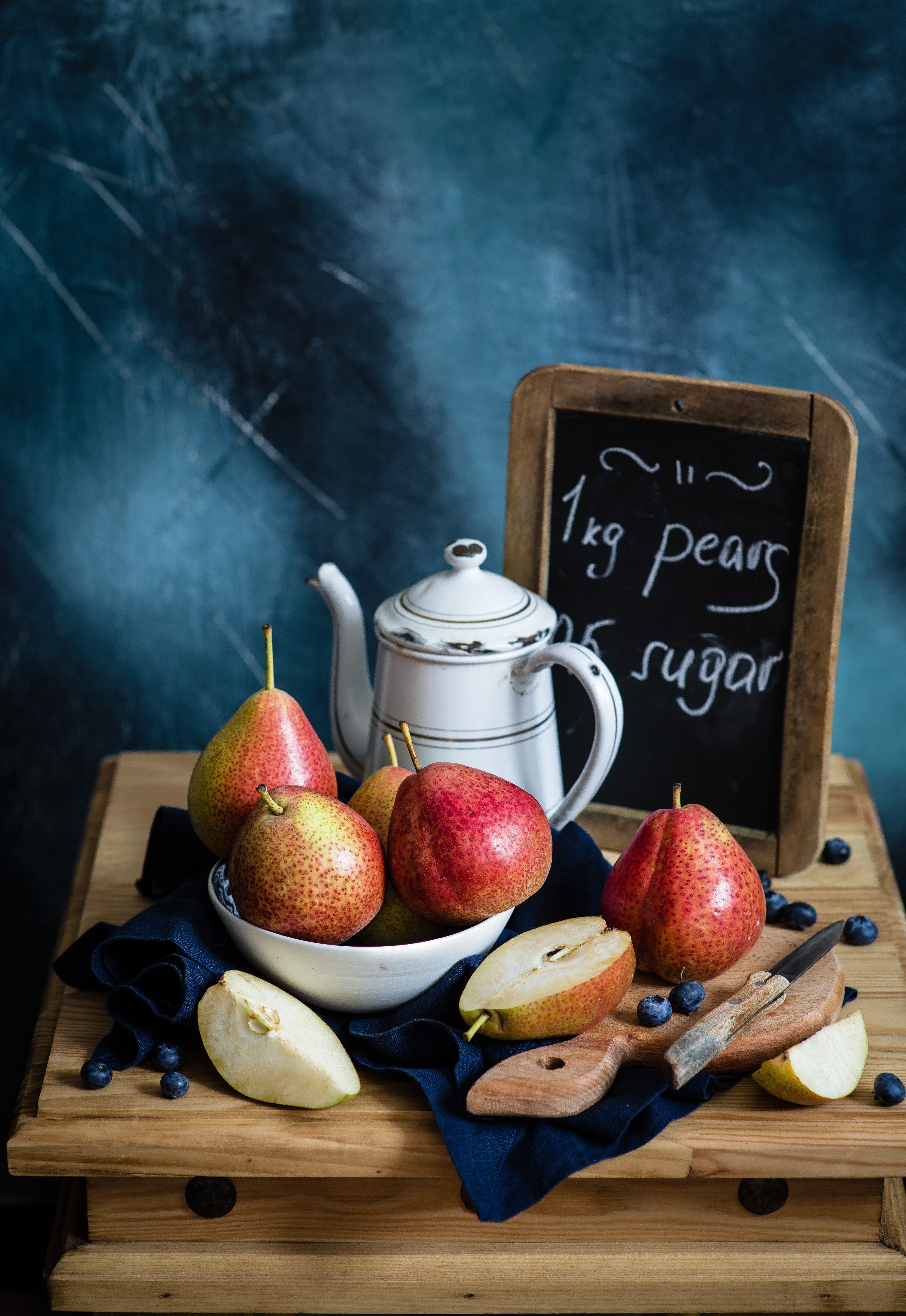 Still-life of pears and blueberries with a teapot and knife HD Phone Wallpaper