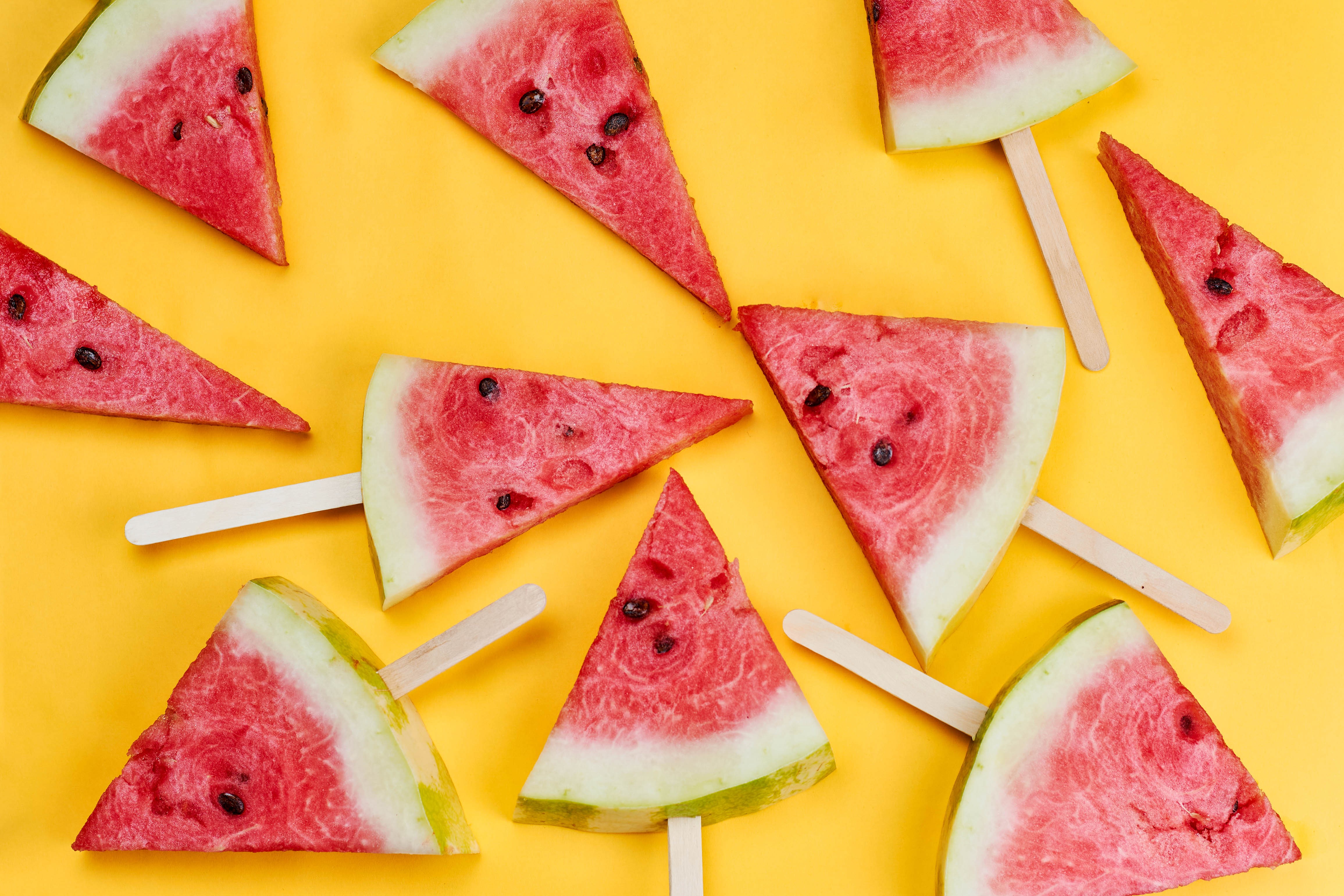 Watermelon slices on a yellow background HD Wallpaper
