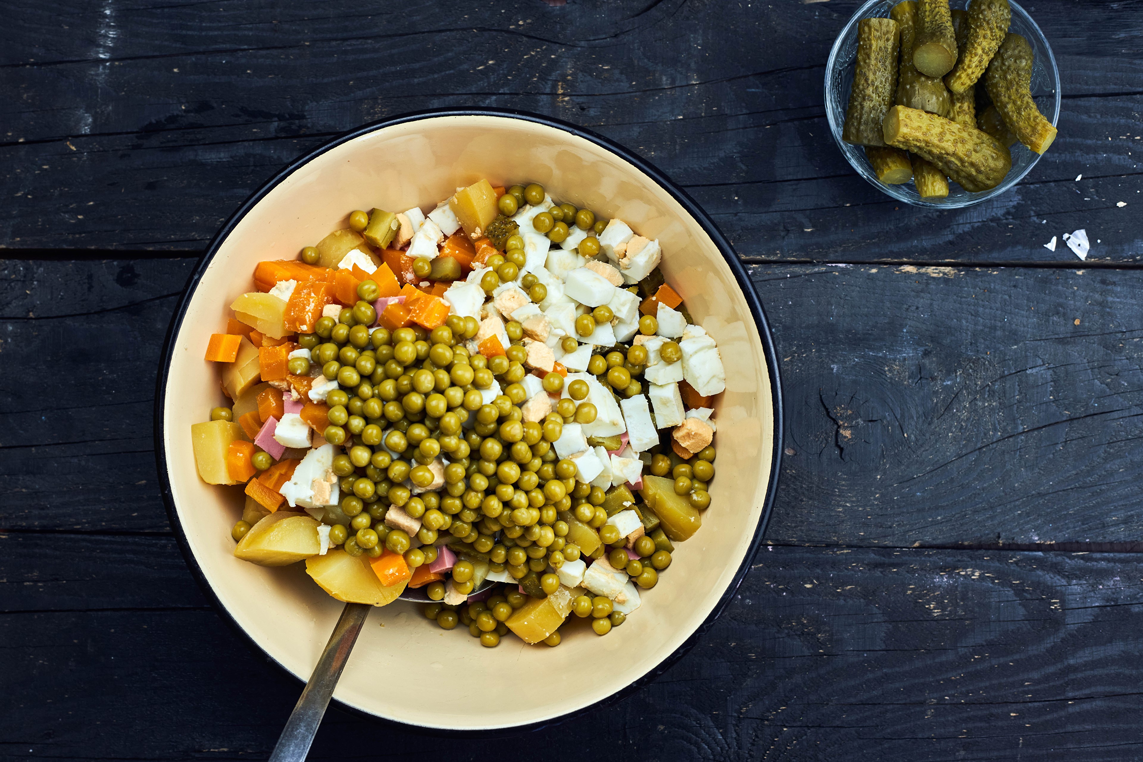 Olivier salad with peas, potatoes, carrots, eggs, and pickles HD Wallpaper