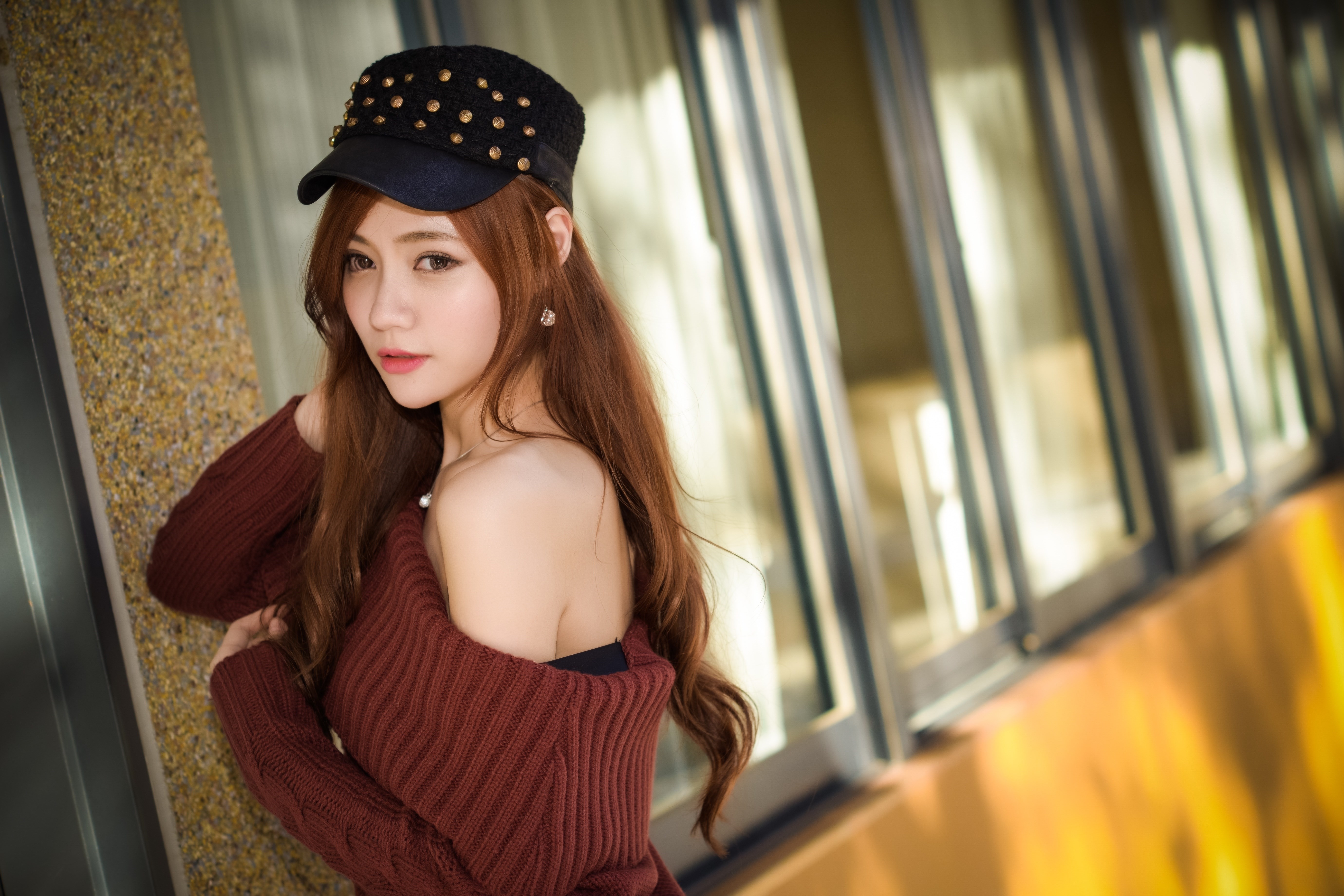 Asian woman with brown hair wearing a baseball cap and sweater HD Wallpaper