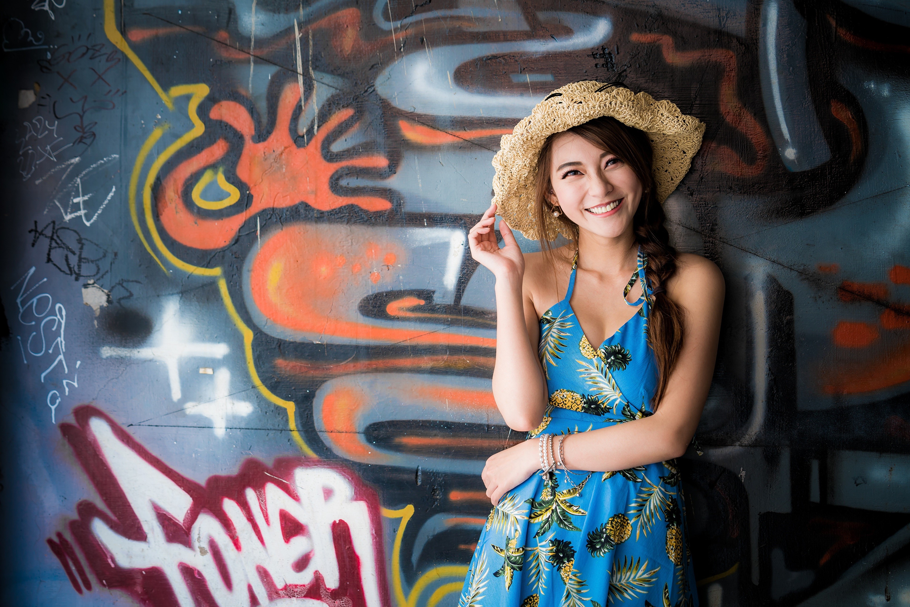 4K Vibrant Graffiti Wall with Smiling Woman HD Wallpaper