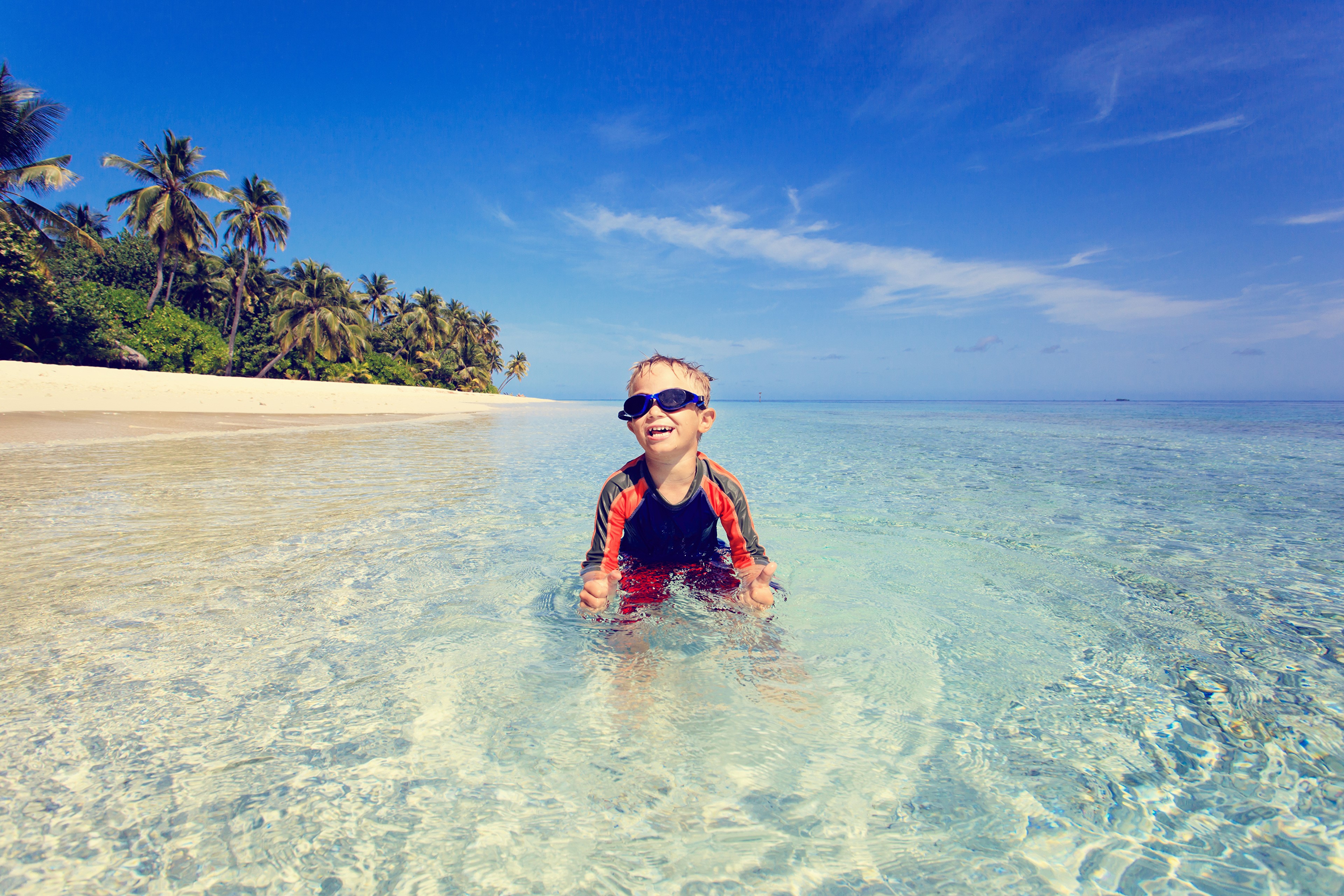 Boy in the sea with palm trees HD Wallpaper