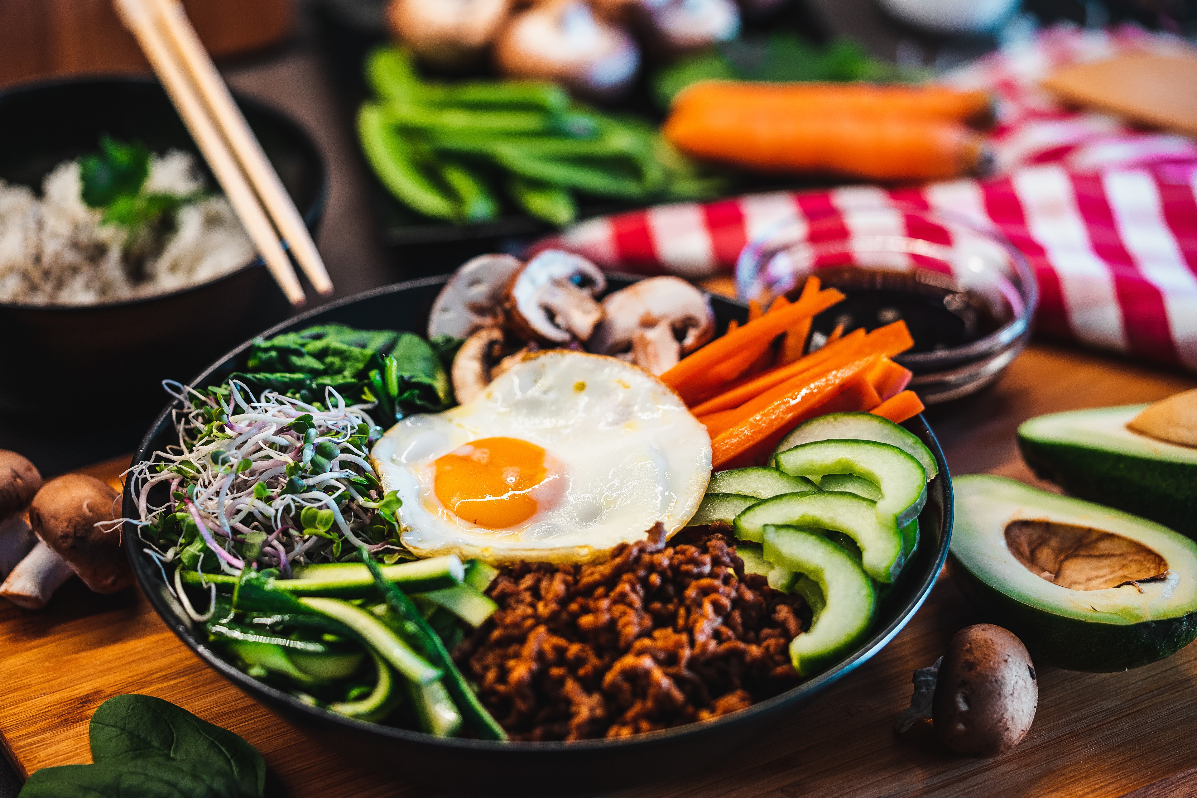 Bibimbap with fried egg, mushrooms, and vegetables HD Wallpaper