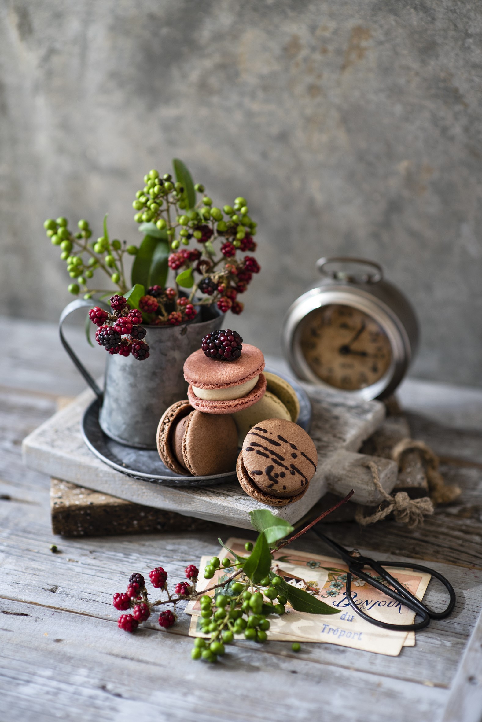 Still life with macarons, berries, and alarm clock HD Phone Wallpaper