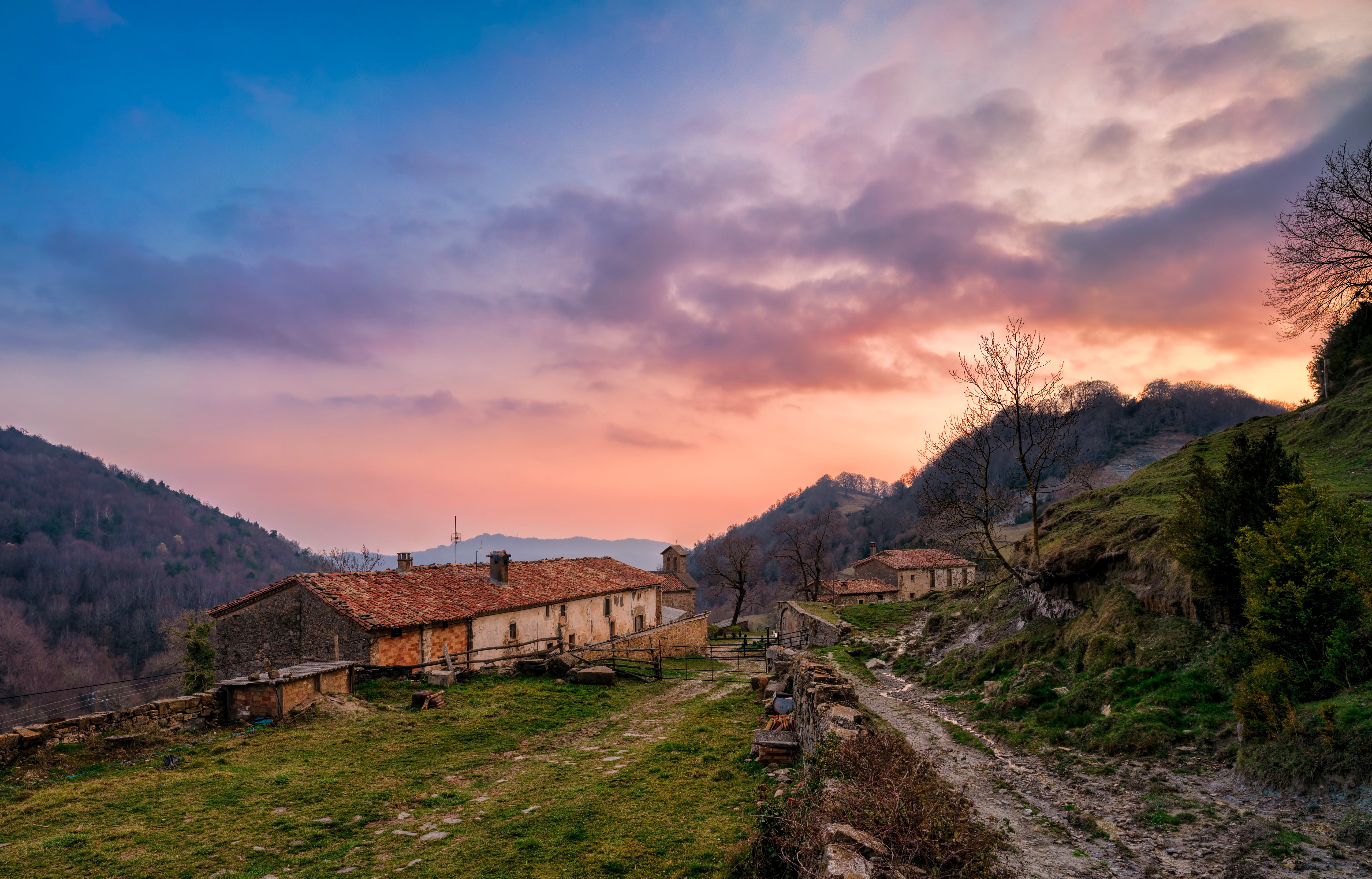 Houses in Santa Maria de Besora, Spain at sunset HD Wallpaper