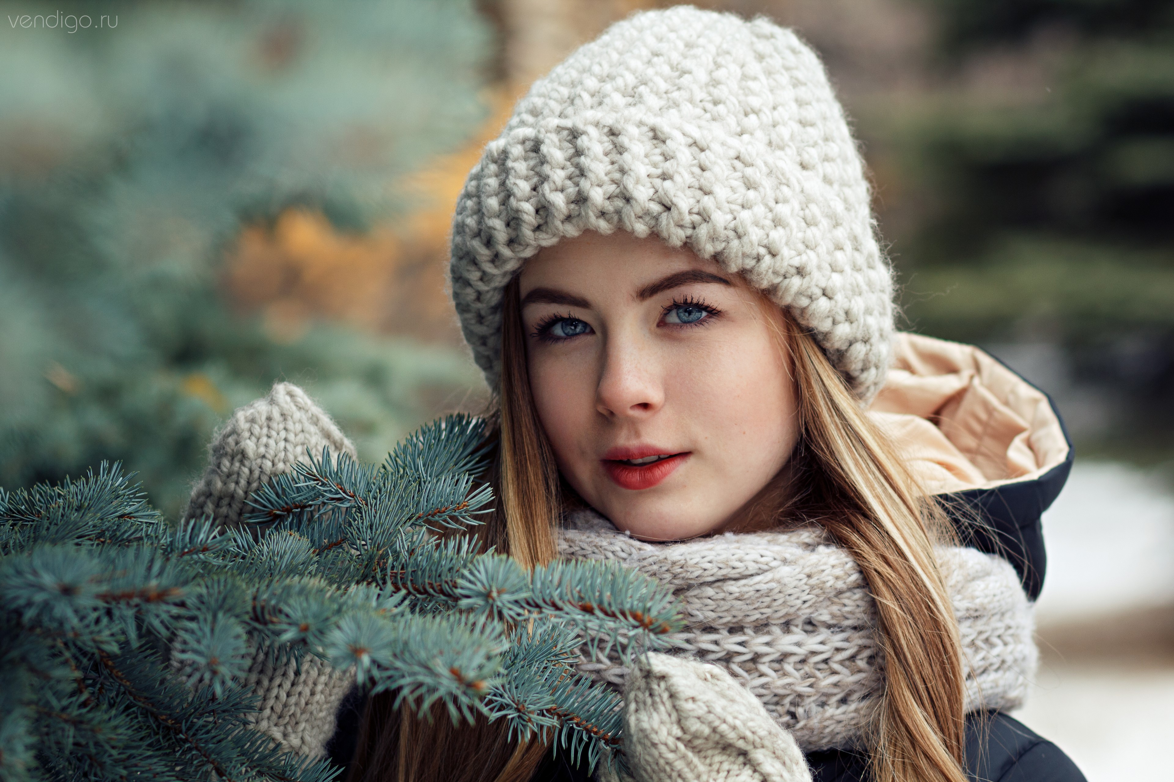 Girl in winter hat and scarf with branches HD Wallpaper