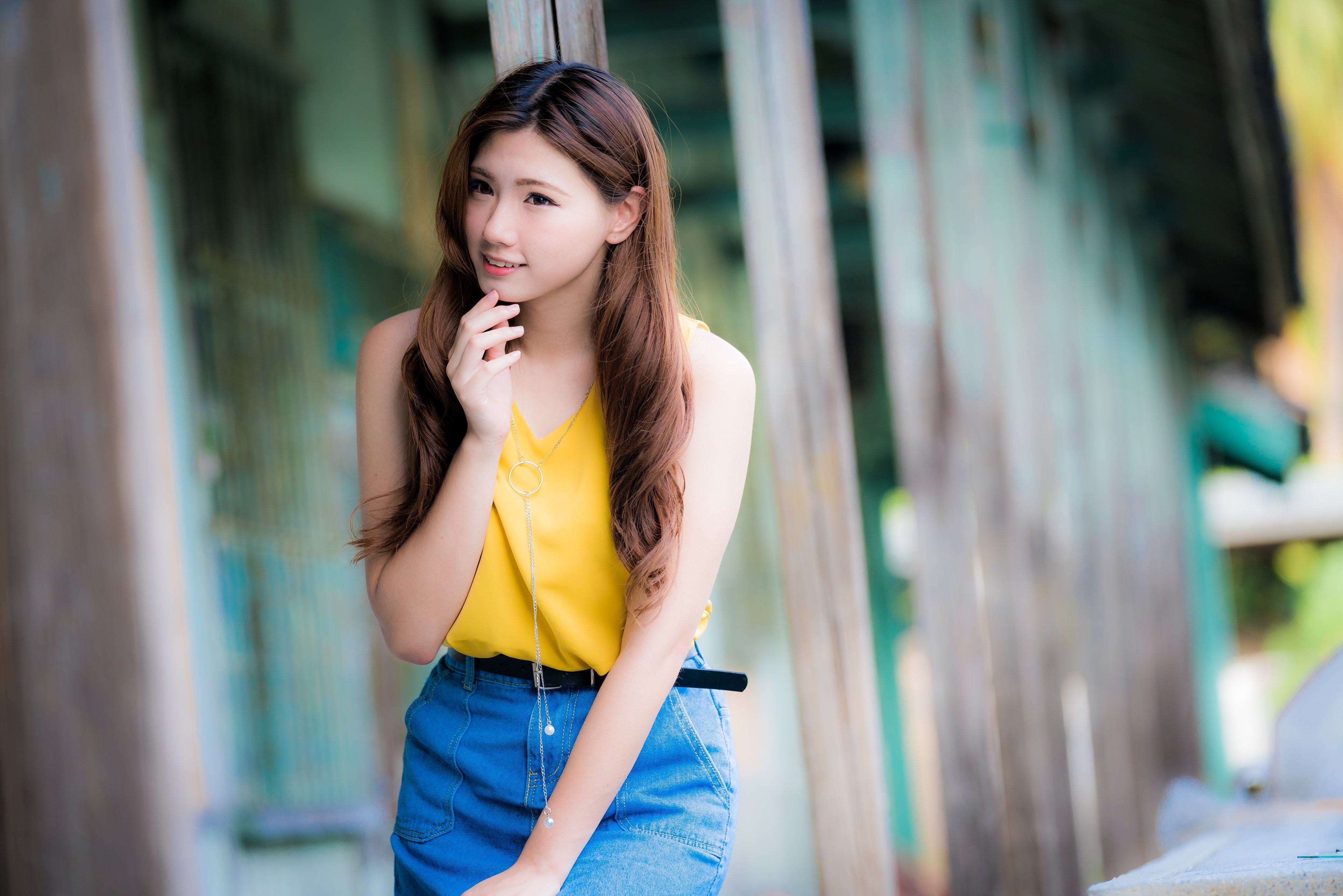 Asian woman with brown hair in yellow top and blue skirt HD Wallpaper